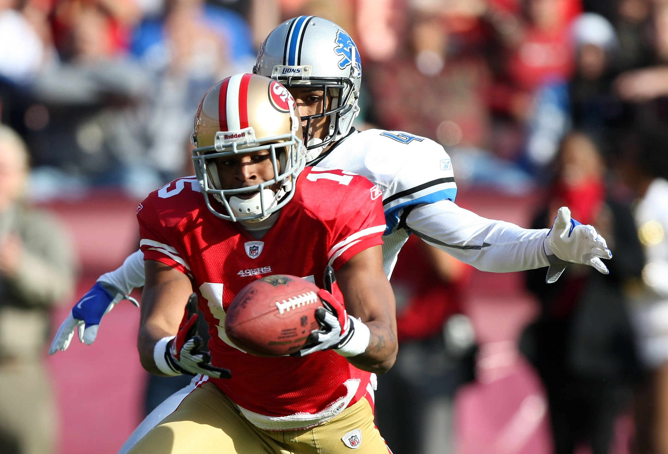 SAN FRANCISCO - DECEMBER 27:  Michael Crabtree #15 of the San Francisco 49ers catches a pass over William James #41 of the Detroit Lions during an NFL game at Candlestick Park on December 27, 2009 in San Francisco, California.  (Photo by Jed Jacobsohn/Get