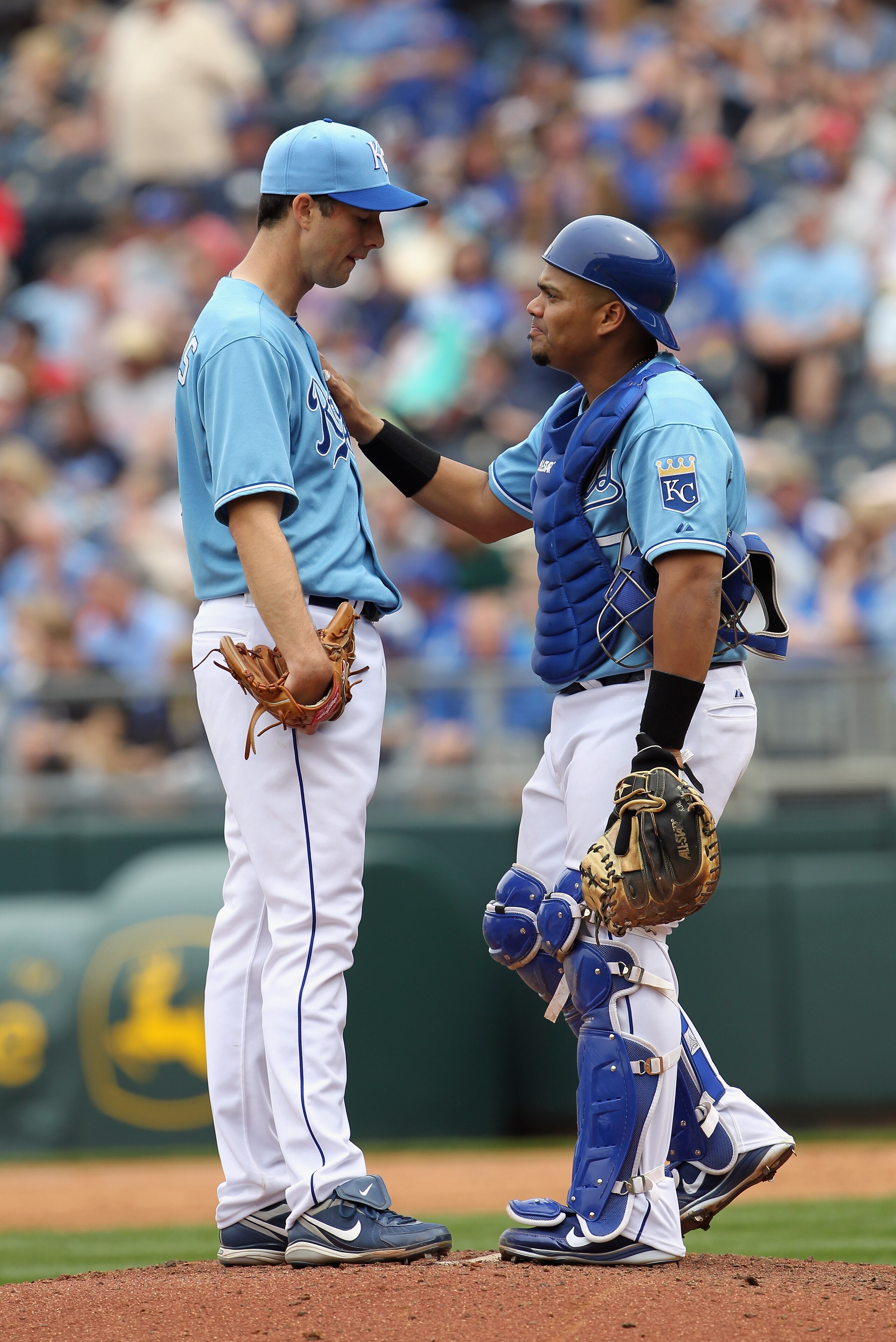 KANSAS CITY, MO - APRIL 17:  Starting pitcher Jeff Francis #26 of the Kansas City Royals consults with catcher Brayan Pena #27 during the game against the Seattle Mariners on April 17, 2011 at Kauffman Stadium in Kansas City, Missouri.  (Photo by Jamie Sq
