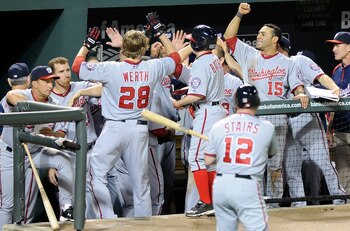 BALTIMORE, MD - MAY 20:  Jayson Werth #28 of the Washington Nationals is congratulated by teammates after hitting a home run in the fifth inning against the Baltimore Orioles at Oriole Park at Camden Yards on May 20, 2011 in Baltimore, Maryland. Washingto