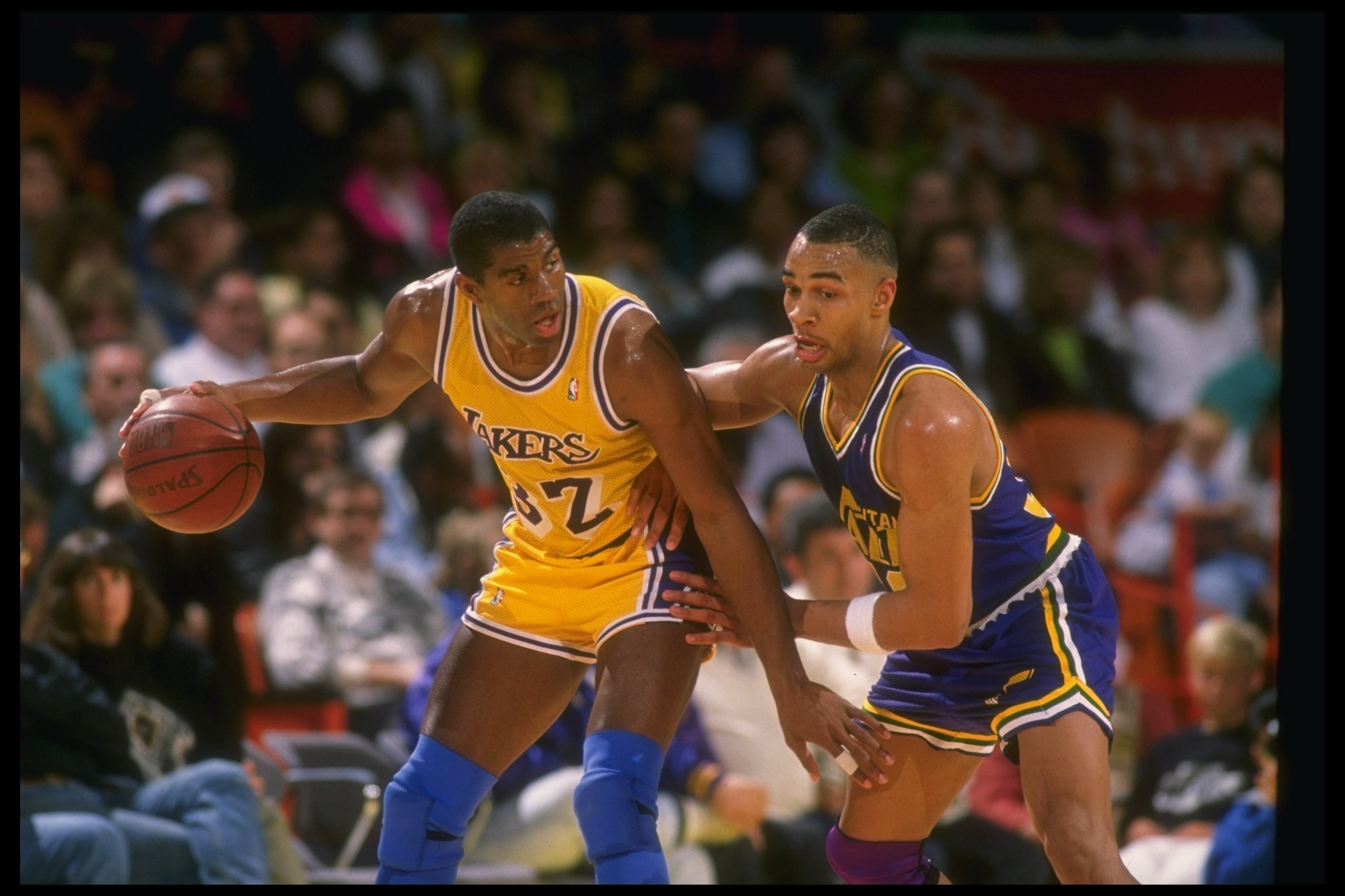 Guard Earvin (Magic) Johnson of the Los Angeles Lakers moves the ball during a game.