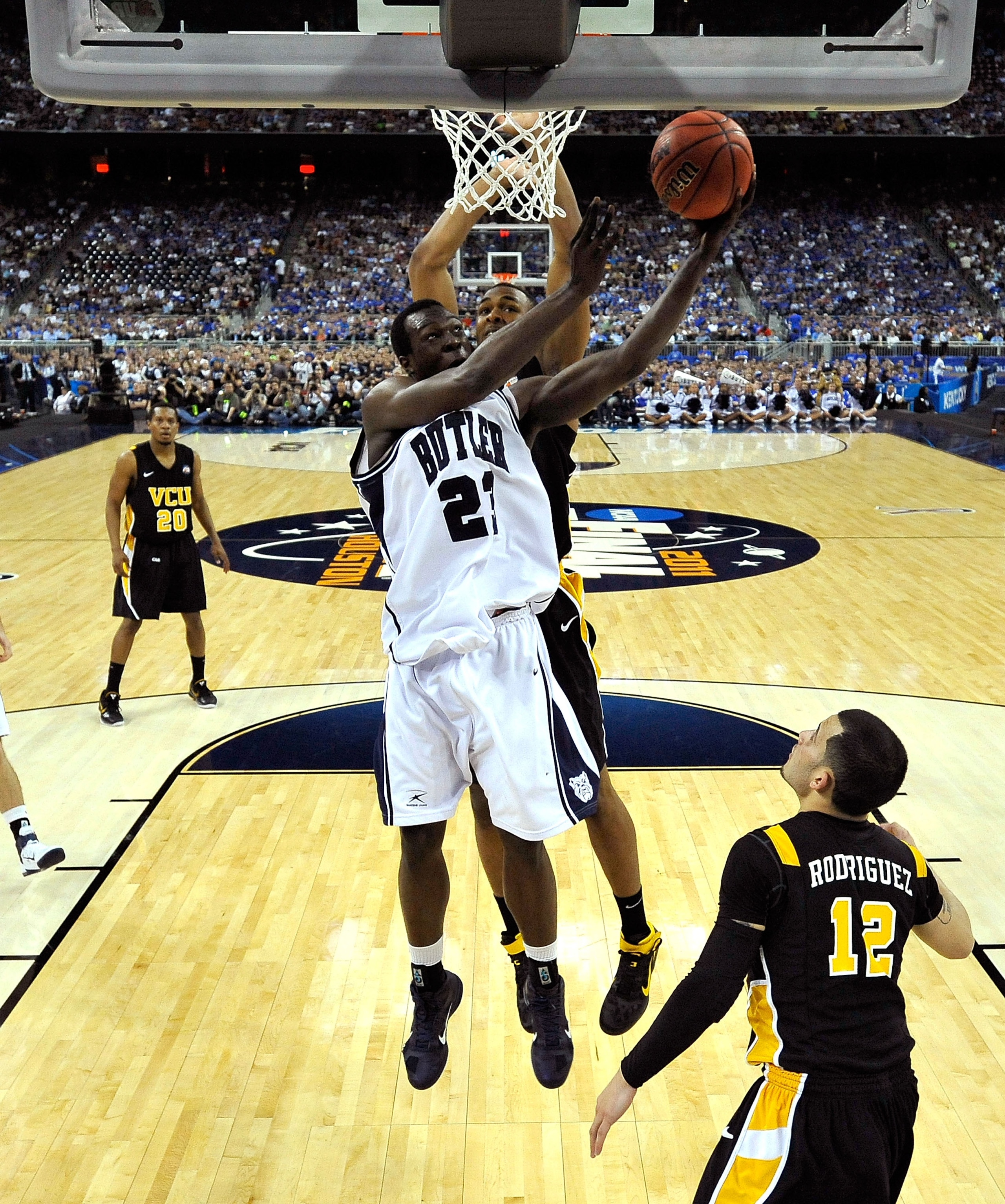 HOUSTON, TX - APRIL 02: Khyle Marshall #23 of the Butler Bulldogs goes to the hoop against Joey Rodriguez #12 of the Virginia Commonwealth Rams during the National Semifinal game of the 2011 NCAA Division I Men's Basketball Championship at Reliant Stadi HOUSTON, TX - APRIL 02: Khyle Marshall #23 of the Butler Bulldogs goes to the hoop against Joey Rodriguez #12 of the Virginia Commonwealth Rams during the National Semifinal game of the 2011 NCAA Division I Men's Basketball Championship at Reliant Stadi