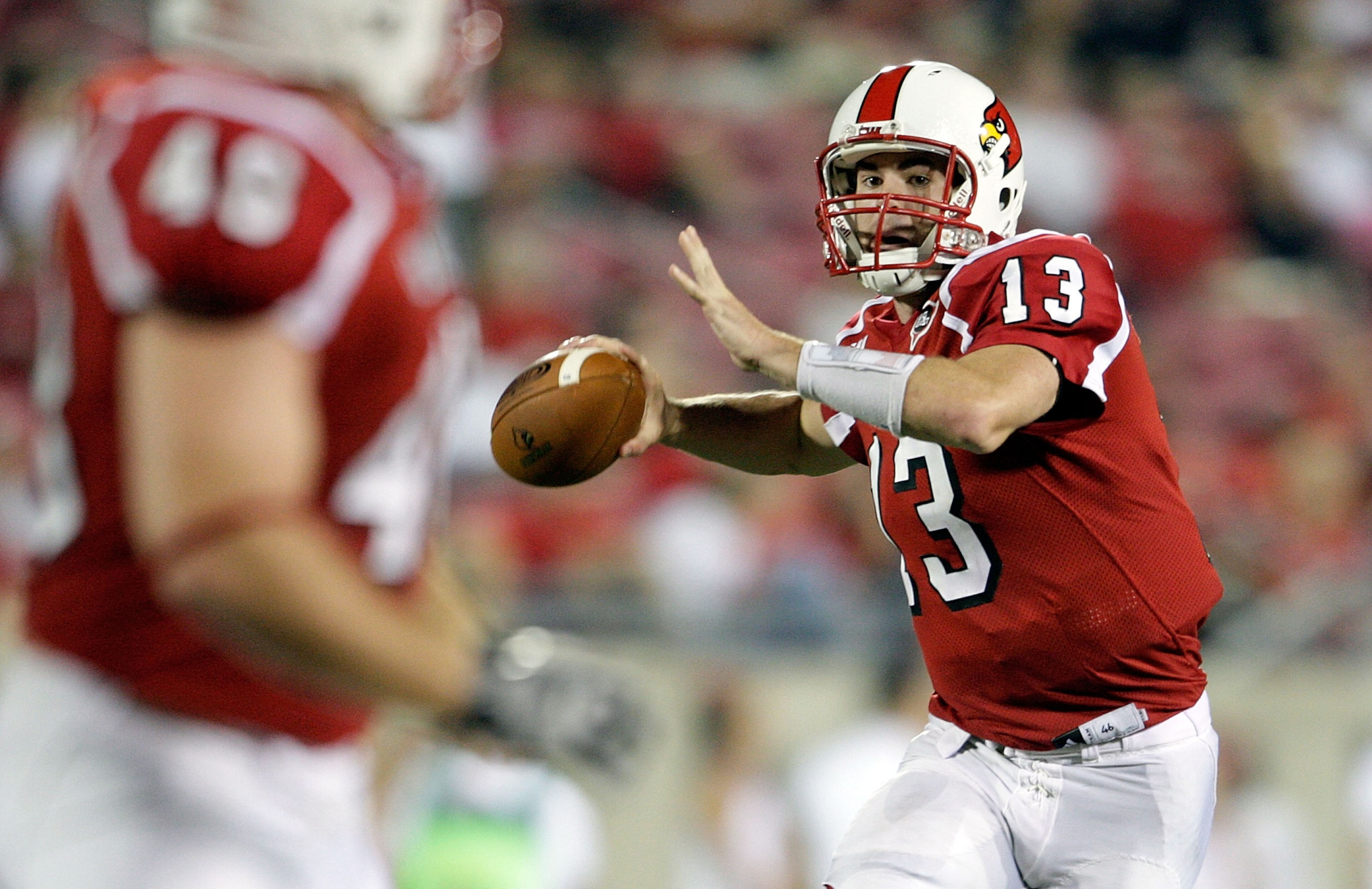 LOUISVILLE, KY - SEPTEMBER 05:  Justin Burke #13 of the Louisville Cardinals looks to pass the ball during the game against the Indiana State Sycamores at Papa John's Cardinal Stadium on September 5, 2009 in Louisville, Kentucky.  (Photo by Andy Lyons/Get