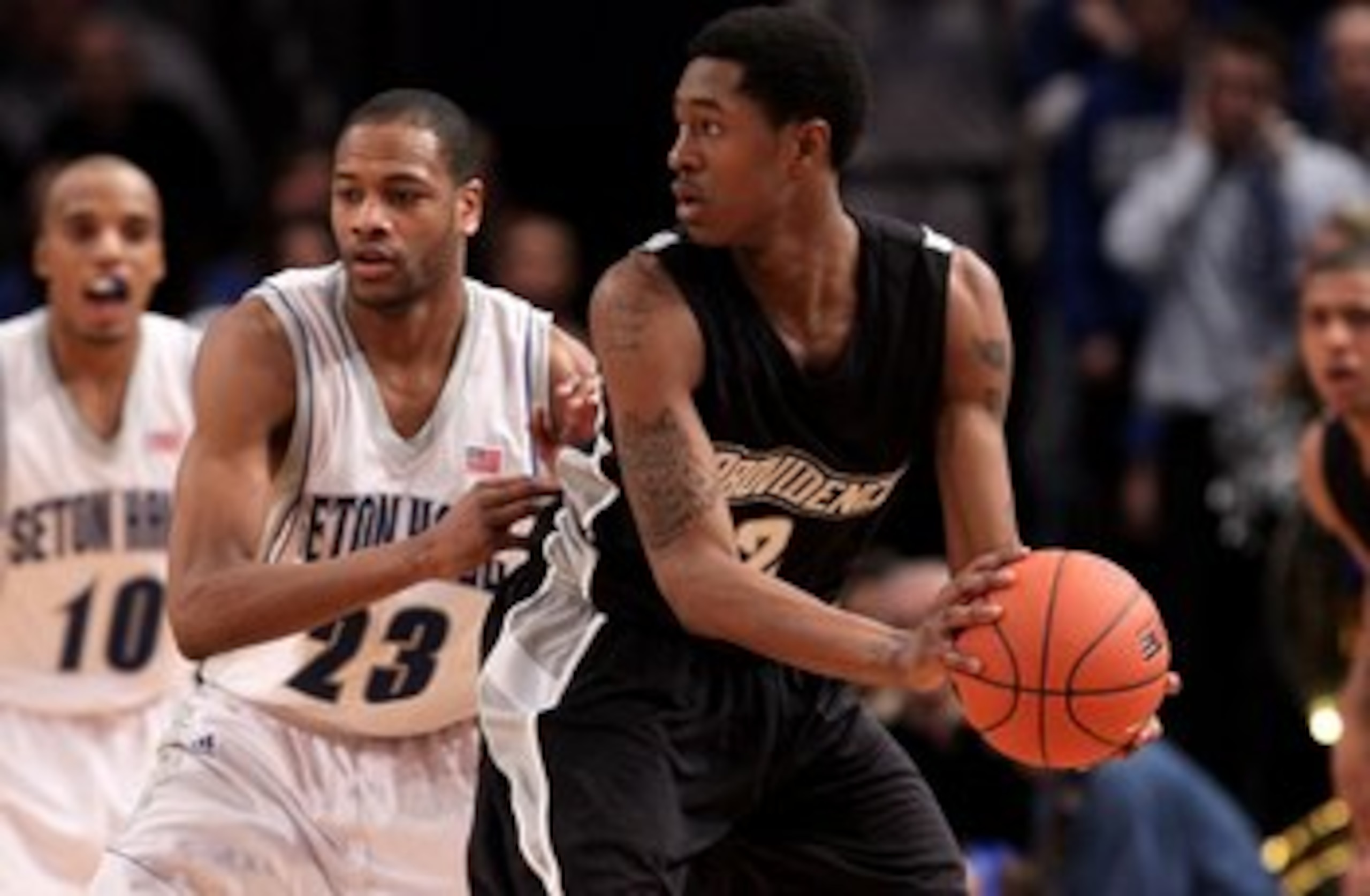 NEW YORK - MARCH 09: Marshon Brooks #2 of the Providence Friars handles the ball against Robert Mitchell #23 of the Seton Hall Pirates during the first round game of the Big East Basketball Tournament at Madison Square Garden on March 9, 2010 in New York,