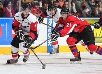 TORONTO, CANADA - JANUARY 19:  Phillip Danault #21 of Team Cherry tries to check Jonathan Huberdeau #11 of Team Orr in the 2011 Home Hardware Top Prospects game on January 19, 2011 at the Air Canada Centre in Toronto, Canada. Team Orr defeated Team Cherry