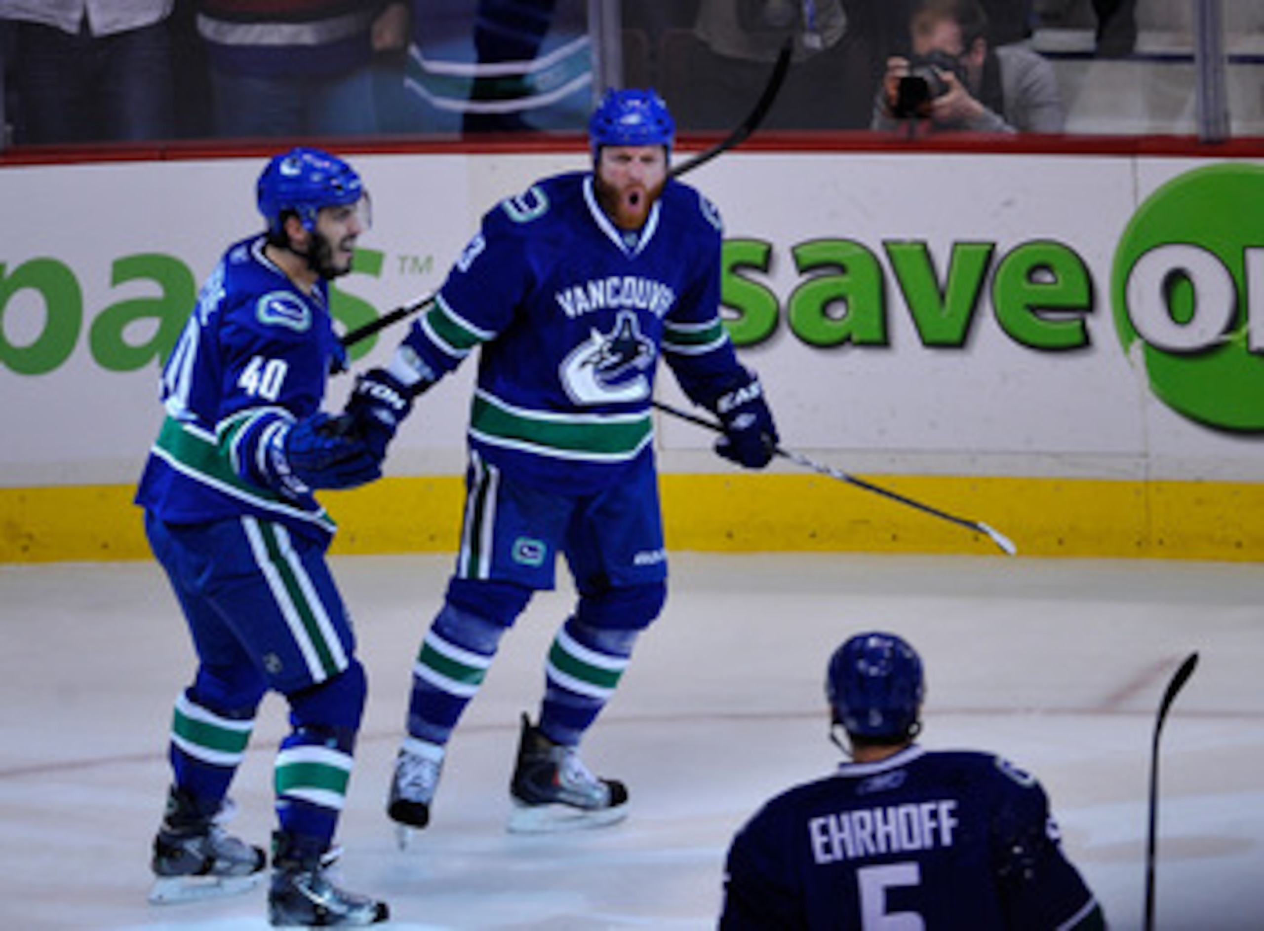 VANCOUVER, CANADA - MAY 18: Raffi Torres #13 of the Vancouver Canucks reacts after scoring a goal as teammate Maxim Lapierre #40 joins Torres to celebrate in Game Two of the Western Conference Finals against the San Jose Sharks during the 2011 Stanley Cu VANCOUVER, CANADA - MAY 18: Raffi Torres #13 of the Vancouver Canucks reacts after scoring a goal as teammate Maxim Lapierre #40 joins Torres to celebrate in Game Two of the Western Conference Finals against the San Jose Sharks during the 2011 Stanley Cu