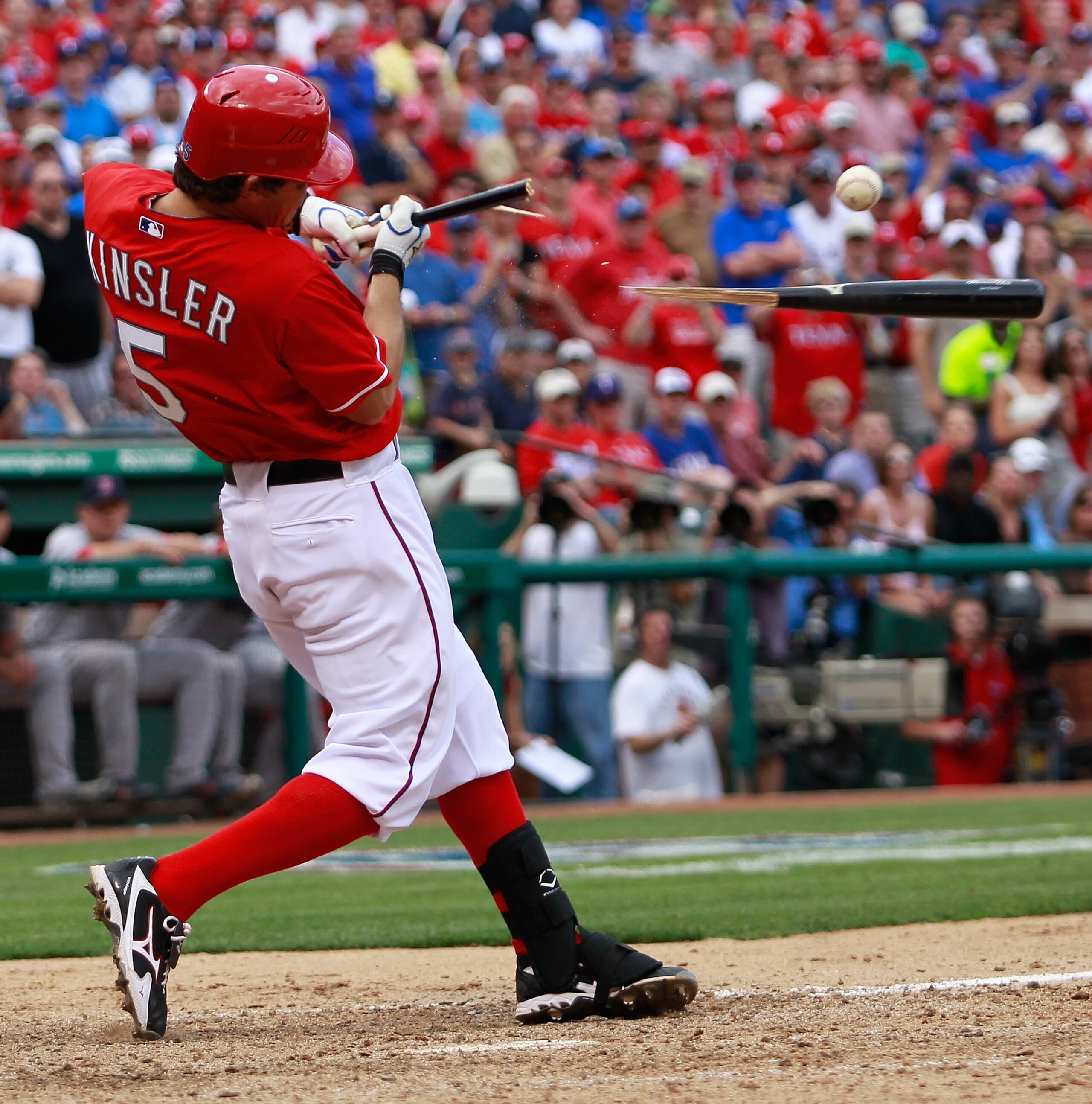ARLINGTON, TX - APRIL 01:  Ian Kinsler #5 of the Texas Rangers shatters his bat on a pitch against the Boston Red Sox on Opening Day at Rangers Ballpark in Arlington on April 1, 2011 in Arlington, Texas.  (Photo by Tom Pennington/Getty Images)