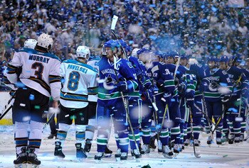 VANCOUVER, CANADA - MAY 24:  Captain Henrik Sedin #33 of the Vancouver Canucks leads his team for the post game handshake with the San Jose Sharks after winning Game Five of the Western Conference Finals 3-2 in the second overtime during the 2011 Stanley 