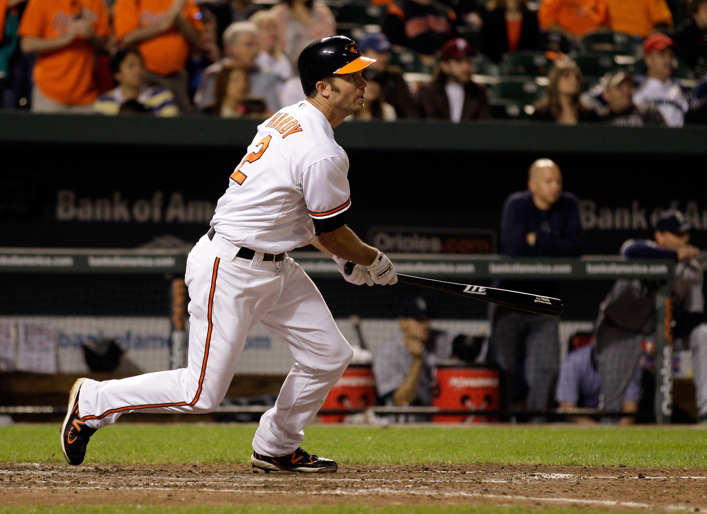 BALTIMORE, MD - MAY 12: J.J. Hardy #2 of the Baltimore Orioles follows his game winning two RBI single against the Seattle Mariners during the twelfth inning at Oriole Park at Camden Yards on May 12, 2011 in Baltimore, Maryland.  (Photo by Rob Carr/Getty