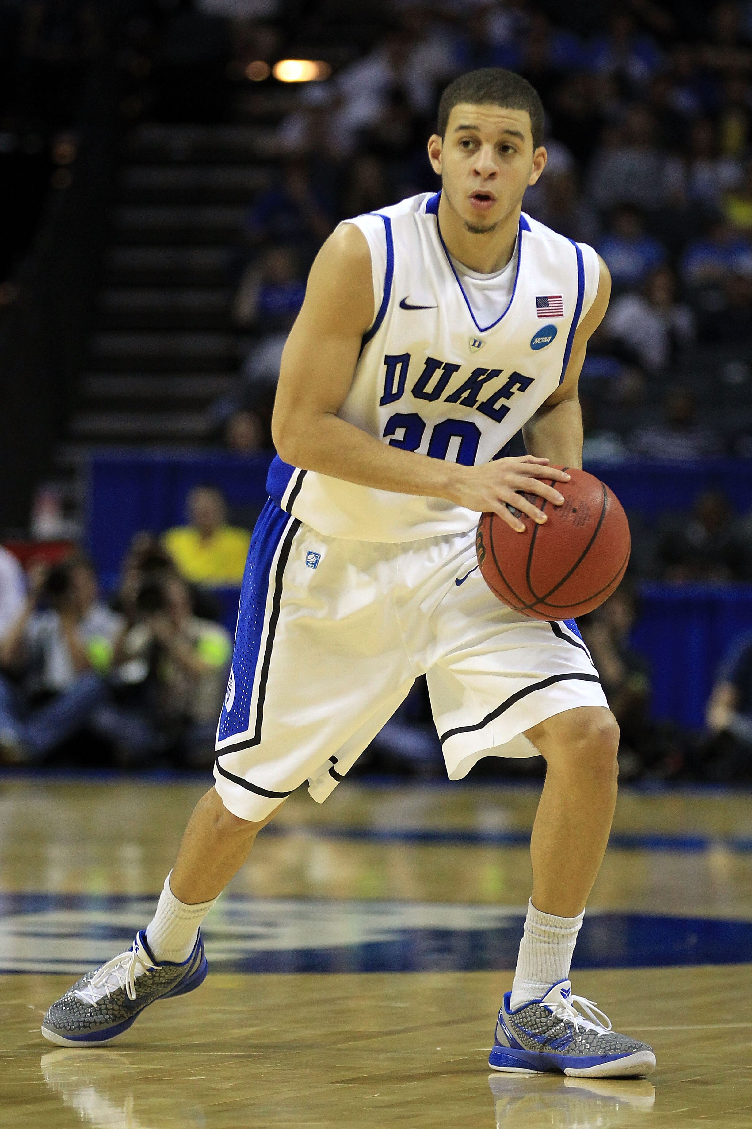 CHARLOTTE, NC - MARCH 20:  Seth Curry #30 of the Duke Blue Devils moves the ball while taking on the Michigan Wolverines during the third round of the 2011 NCAA men's basketball tournament at Time Warner Cable Arena on March 20, 2011 in Charlotte, North C