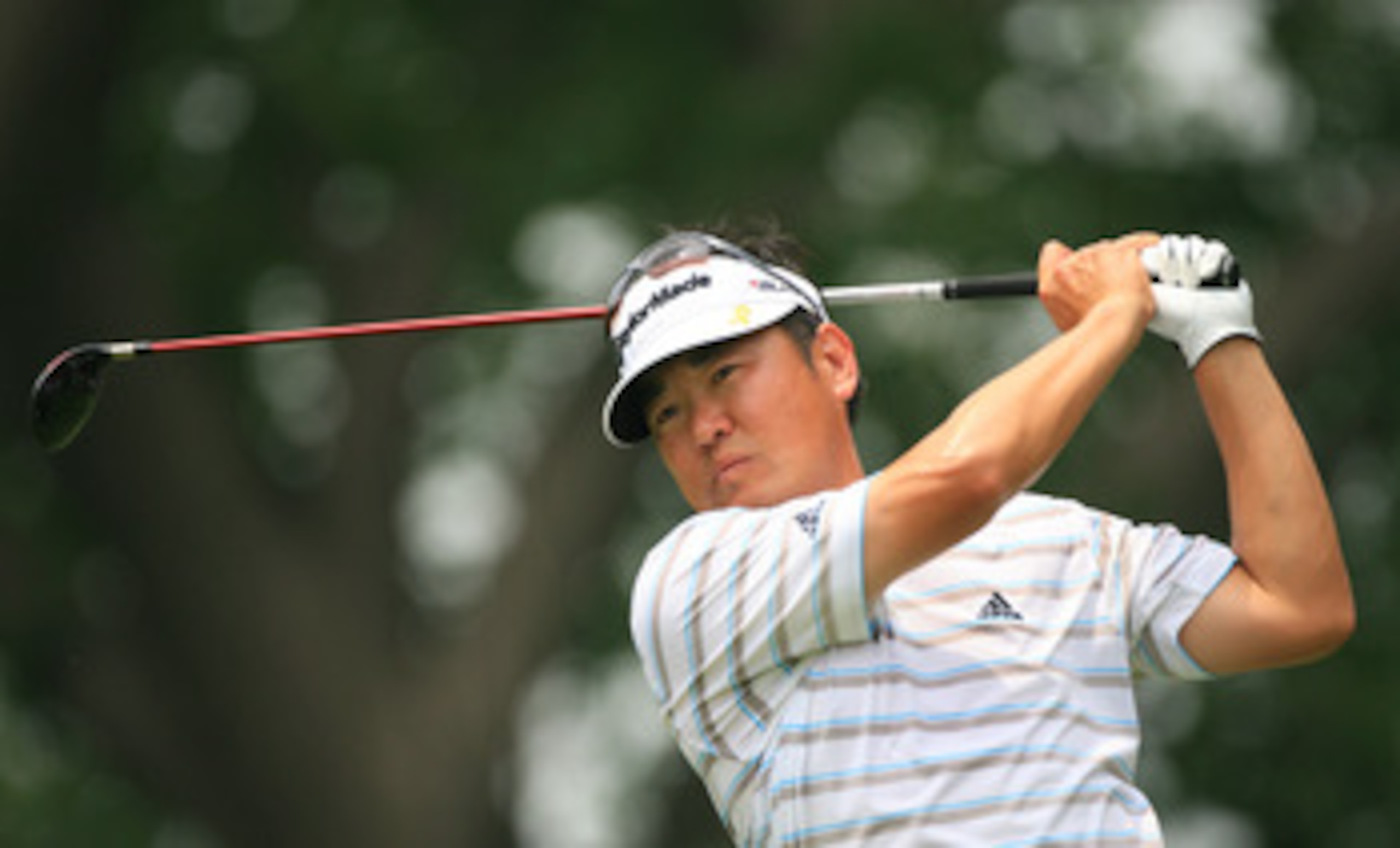 FORT WORTH, TX - MAY 22: Charlie Wi hits his tee shot on the ninth hole during the Crowne Plaza Invitational at Colonial Country Club on May 22, 2011 in Fort Worth, Texas. (Photo by Hunter Martin/Getty Images)