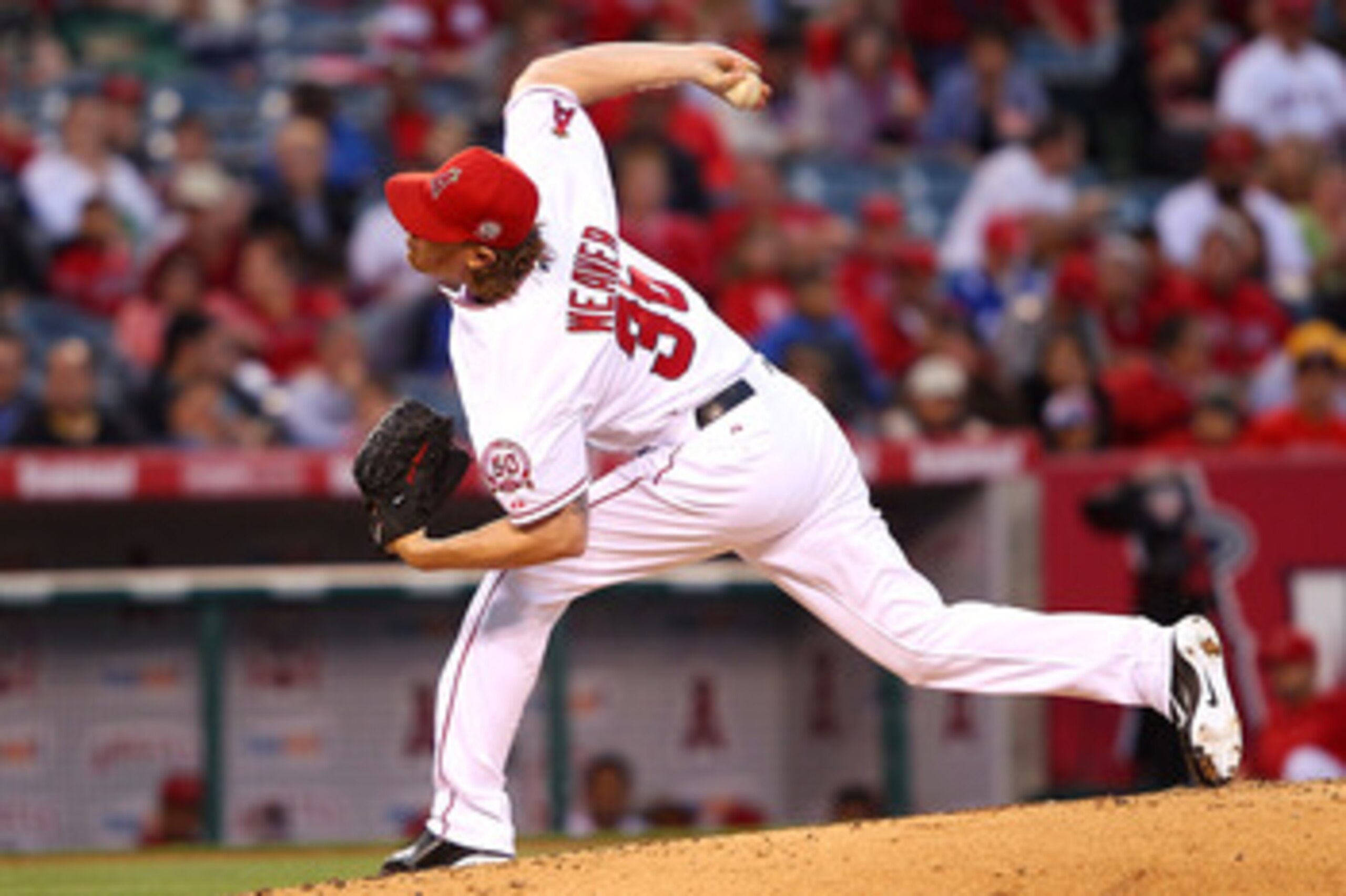 ANAHEIM, CA - MAY 23:  Jered Weaver #36 of the Los Angeles Angels of Anaheim pitches in the second inning against the Oakland Athletics during the game at Angel Stadium of Anaheim on May 23, 2011 in Anaheim, California.  (Photo by Joe Scarnici/Getty Image