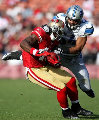 SAN FRANCISCO - DECEMBER 27:  Delanie Walker #46 of the San Francisco 49ers is tackled by DeAndre Levy #54 of the Detroit Lions during an NFL game at Candlestick Park on December 27, 2009 in San Francisco, California.  (Photo by Jed Jacobsohn/Getty Images