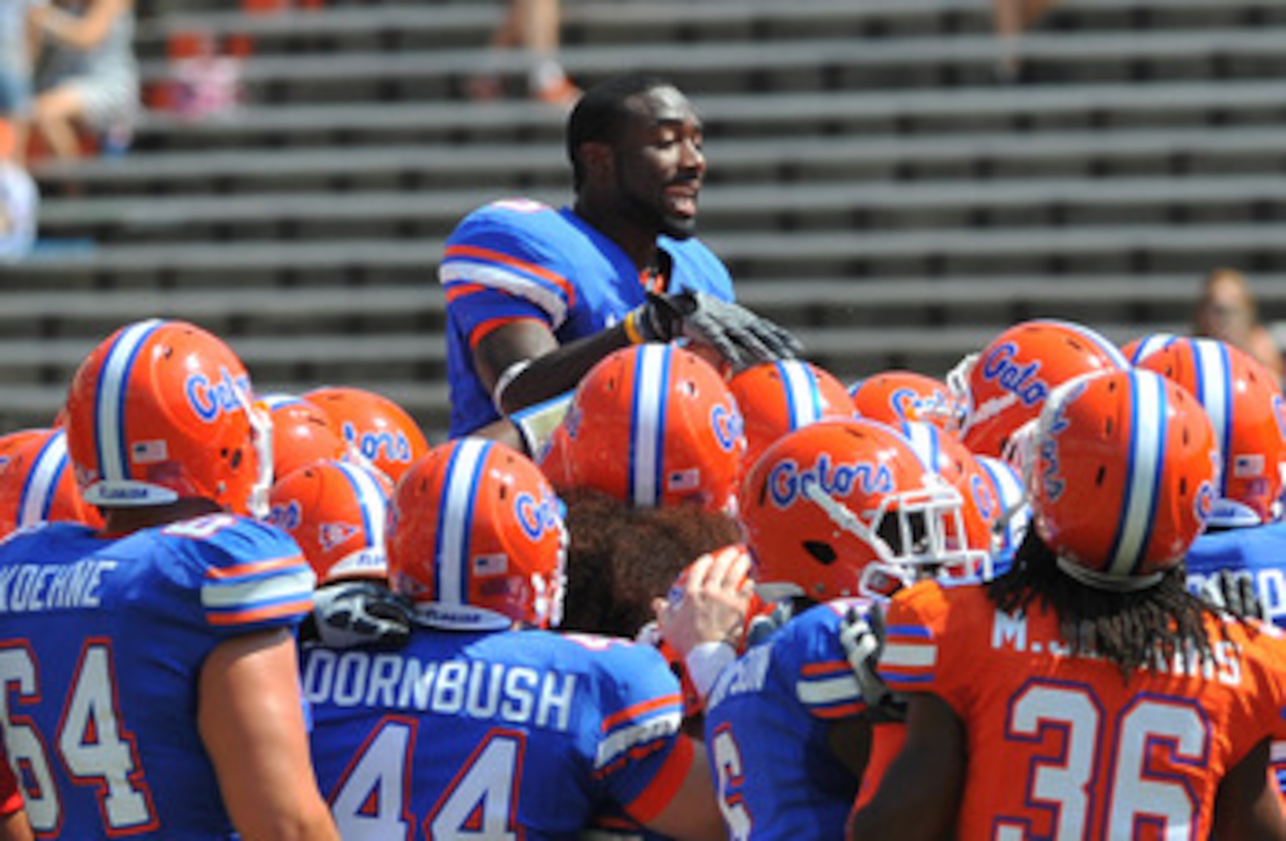 GAINESVILLE, FL - APRIL 9: Running back Chris Rainey #3 of the Florida Gators climbs to the top of a team huddle before the Orange and Blue spring football game April 9, 2011 at Ben Hill Griffin Stadium in Gainesville, Florida. (Photo by Al Messerschmid GAINESVILLE, FL - APRIL 9: Running back Chris Rainey #3 of the Florida Gators climbs to the top of a team huddle before the Orange and Blue spring football game April 9, 2011 at Ben Hill Griffin Stadium in Gainesville, Florida. (Photo by Al Messerschmid