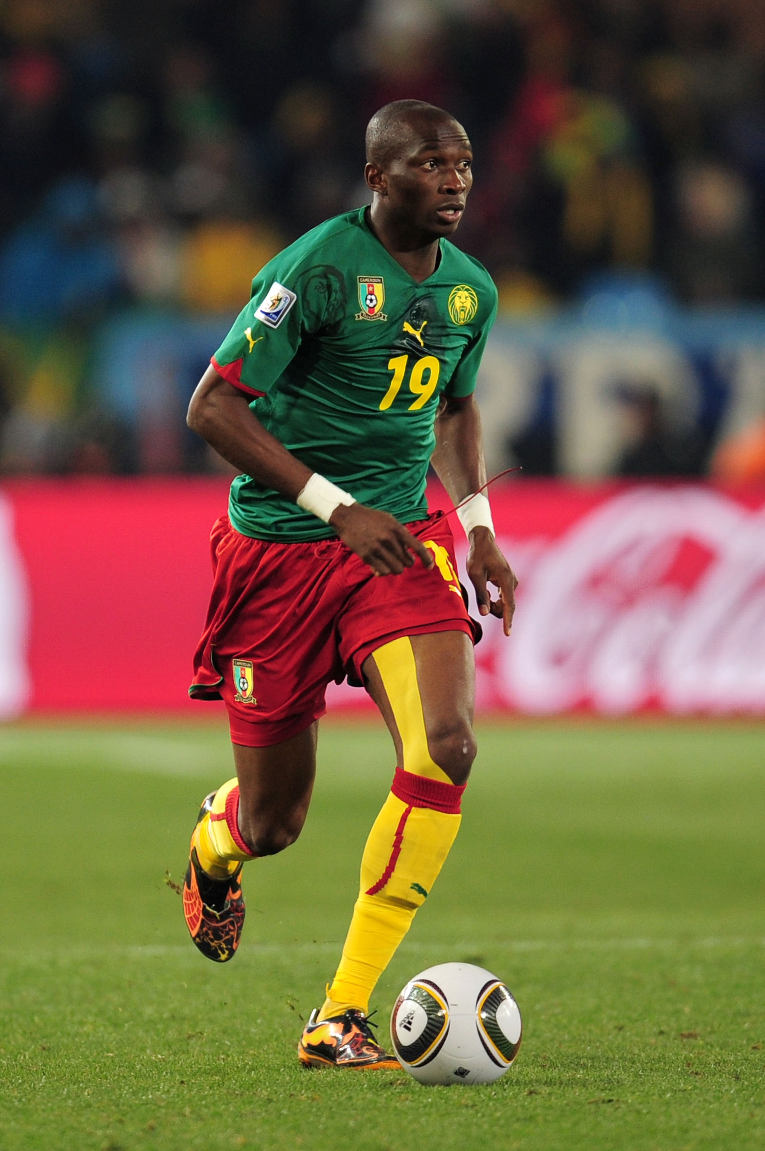 PRETORIA, SOUTH AFRICA - JUNE 19:  Stephane Mbia of Cameroon runs with the ball during the 2010 FIFA World Cup South Africa Group E match between Cameroon and Denmark at Loftus Versfeld Stadium on June 19, 2010 in Tshwane/Pretoria, South Africa.  (Photo b