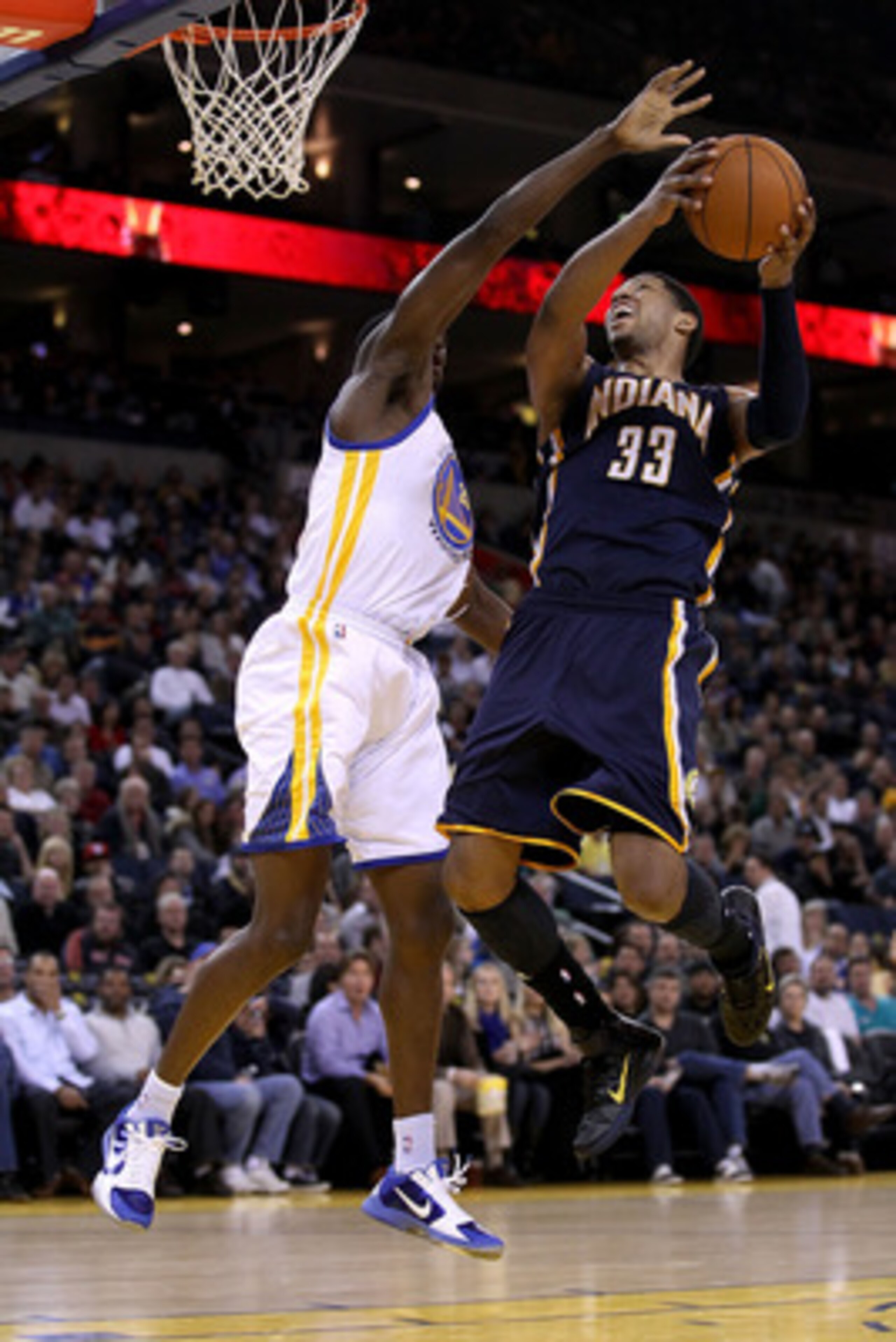 OAKLAND, CA - JANUARY 19:  Danny Granger #33 of the Indiana Pacers goes up for a shot on Ekpe Udoh #20 of the Golden State Warriors at Oracle Arena on January 19, 2011 in Oakland, California.  NOTE TO USER: User expressly acknowledges and agrees that, by