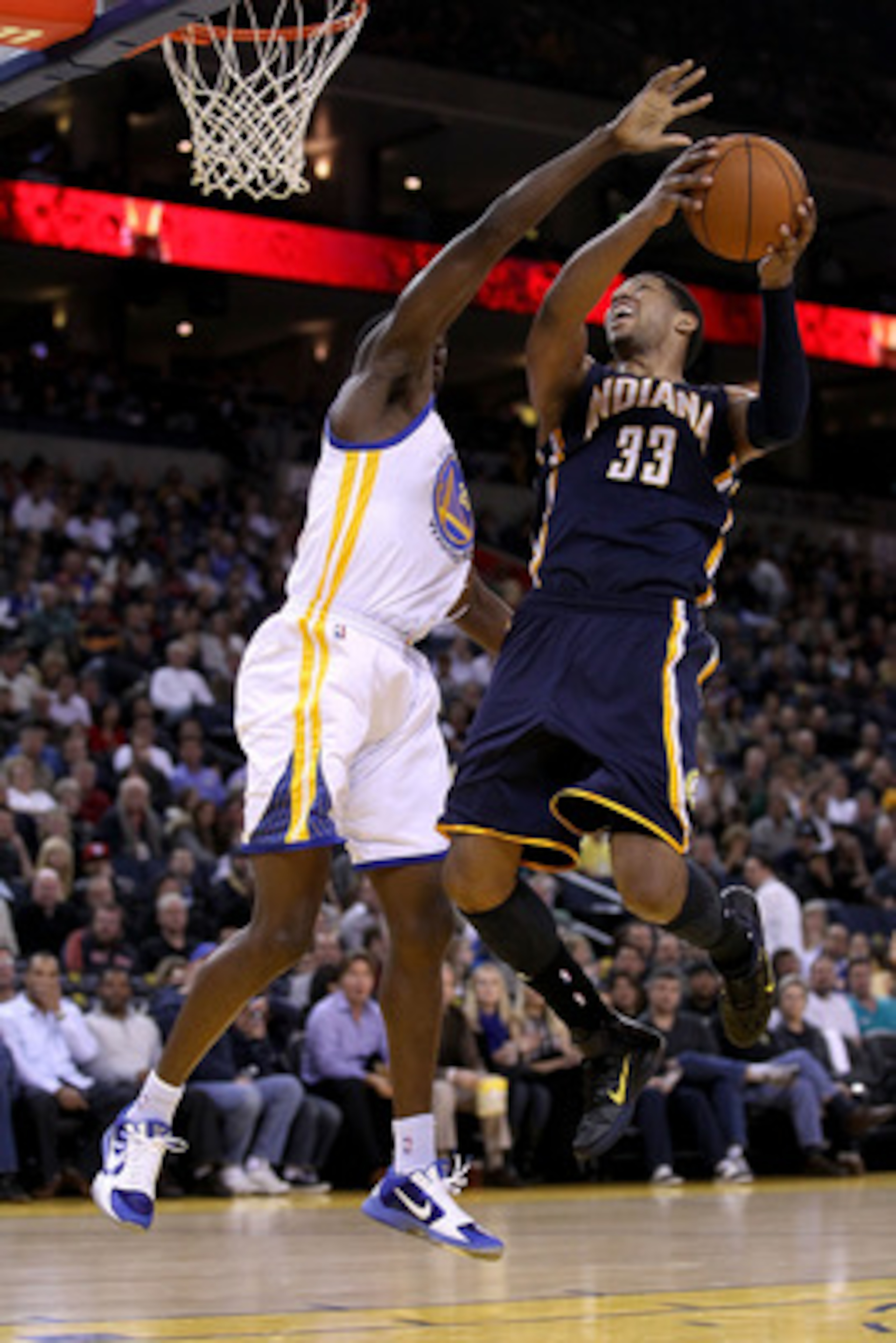 OAKLAND, CA - JANUARY 19:  Danny Granger #33 of the Indiana Pacers goes up for a shot on Ekpe Udoh #20 of the Golden State Warriors at Oracle Arena on January 19, 2011 in Oakland, California.  NOTE TO USER: User expressly acknowledges and agrees that, by