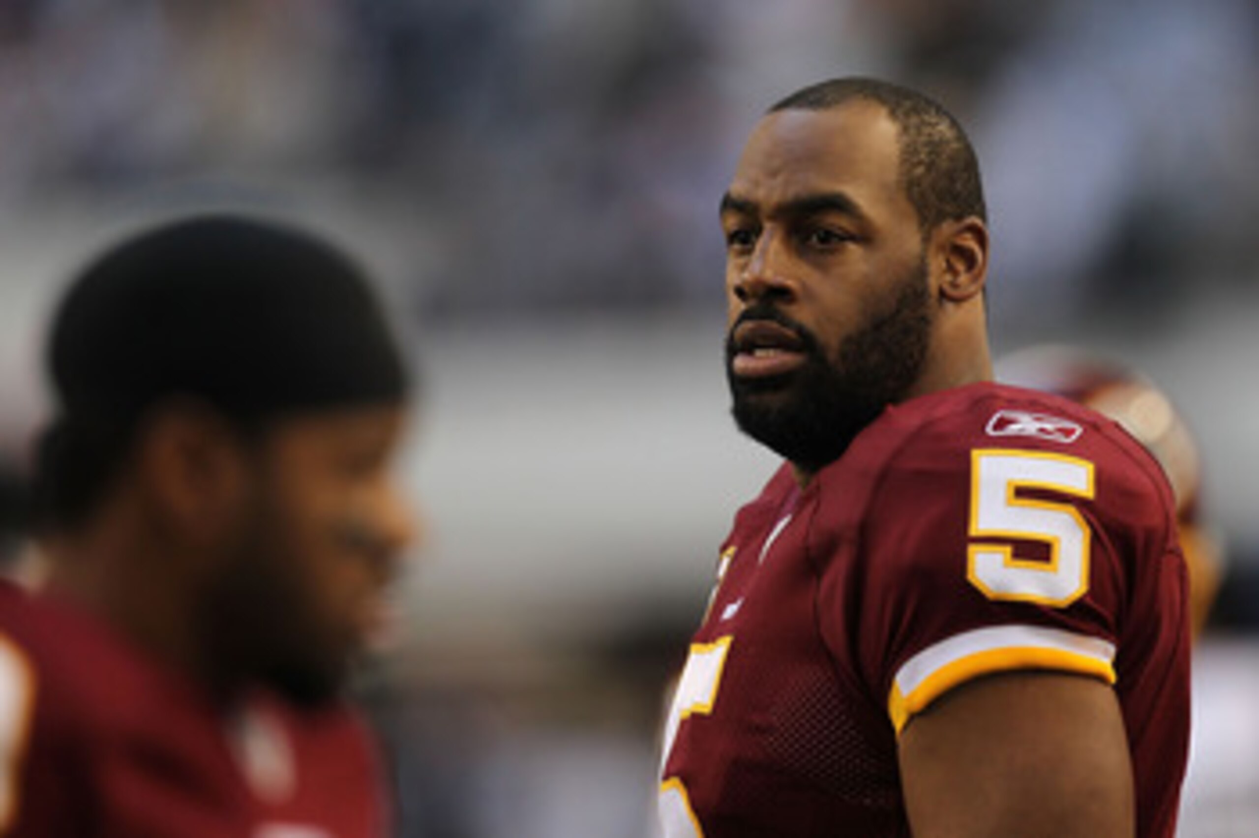 ARLINGTON, TX - DECEMBER 19: Quarterback Donovan McNabb #5 of the Washington Redskins on the sidelines against play against the Dallas Cowboys at Cowboys Stadium on December 19, 2010 in Arlington, Texas. (Photo by Ronald Martinez/Getty Images) ARLINGTON, TX - DECEMBER 19: Quarterback Donovan McNabb #5 of the Washington Redskins on the sidelines against play against the Dallas Cowboys at Cowboys Stadium on December 19, 2010 in Arlington, Texas. (Photo by Ronald Martinez/Getty Images)