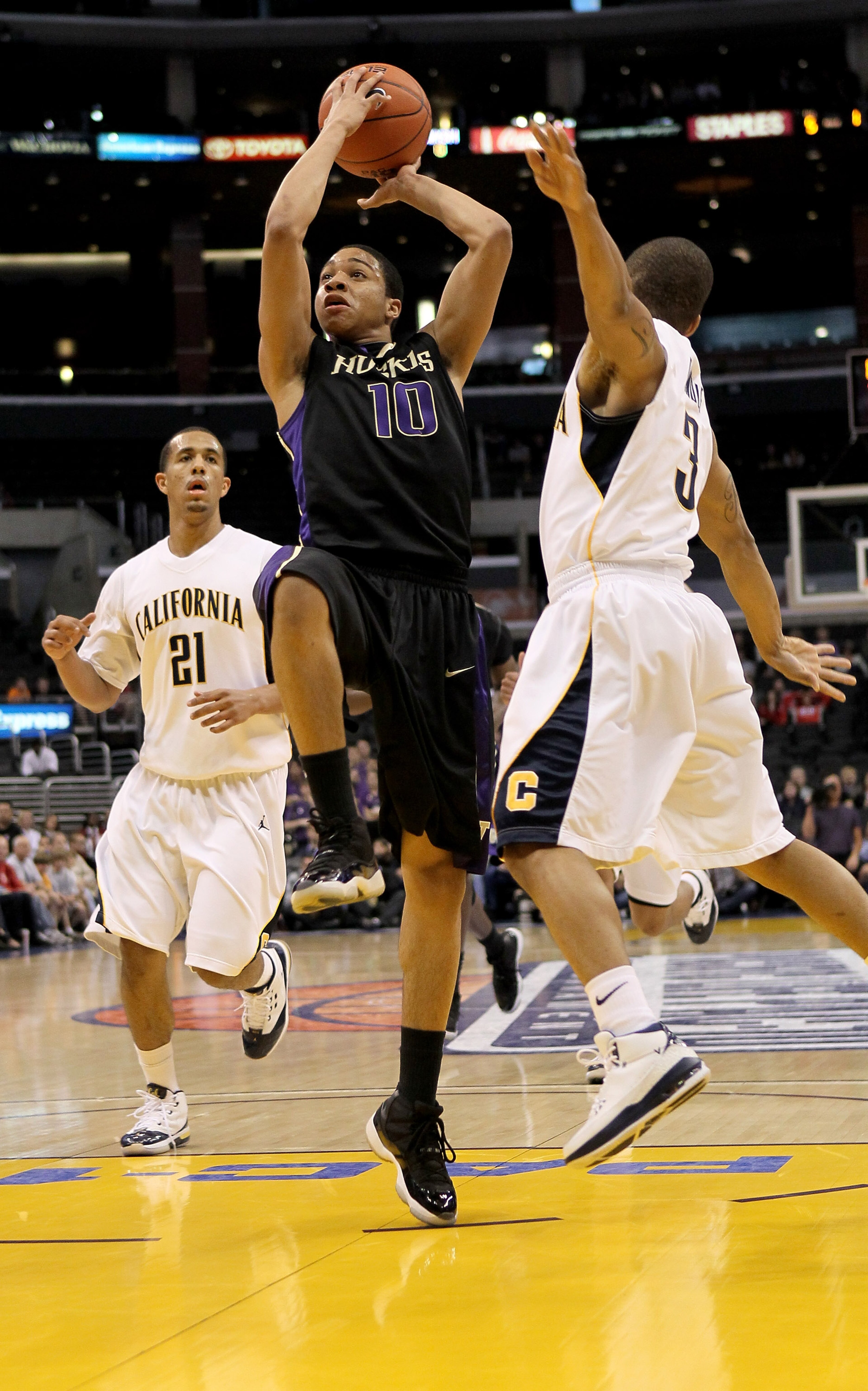 LOS ANGELES, CA - MARCH 13: Abdul Gaddy #10 of the Washington Huskies goes up for a shot over Jerome Randle #3 and Omondi Amoke #21 of the California Golden Bears during the championship game of the Pac-10 Basketball Tournament at Staples Center on March LOS ANGELES, CA - MARCH 13: Abdul Gaddy #10 of the Washington Huskies goes up for a shot over Jerome Randle #3 and Omondi Amoke #21 of the California Golden Bears during the championship game of the Pac-10 Basketball Tournament at Staples Center on March
