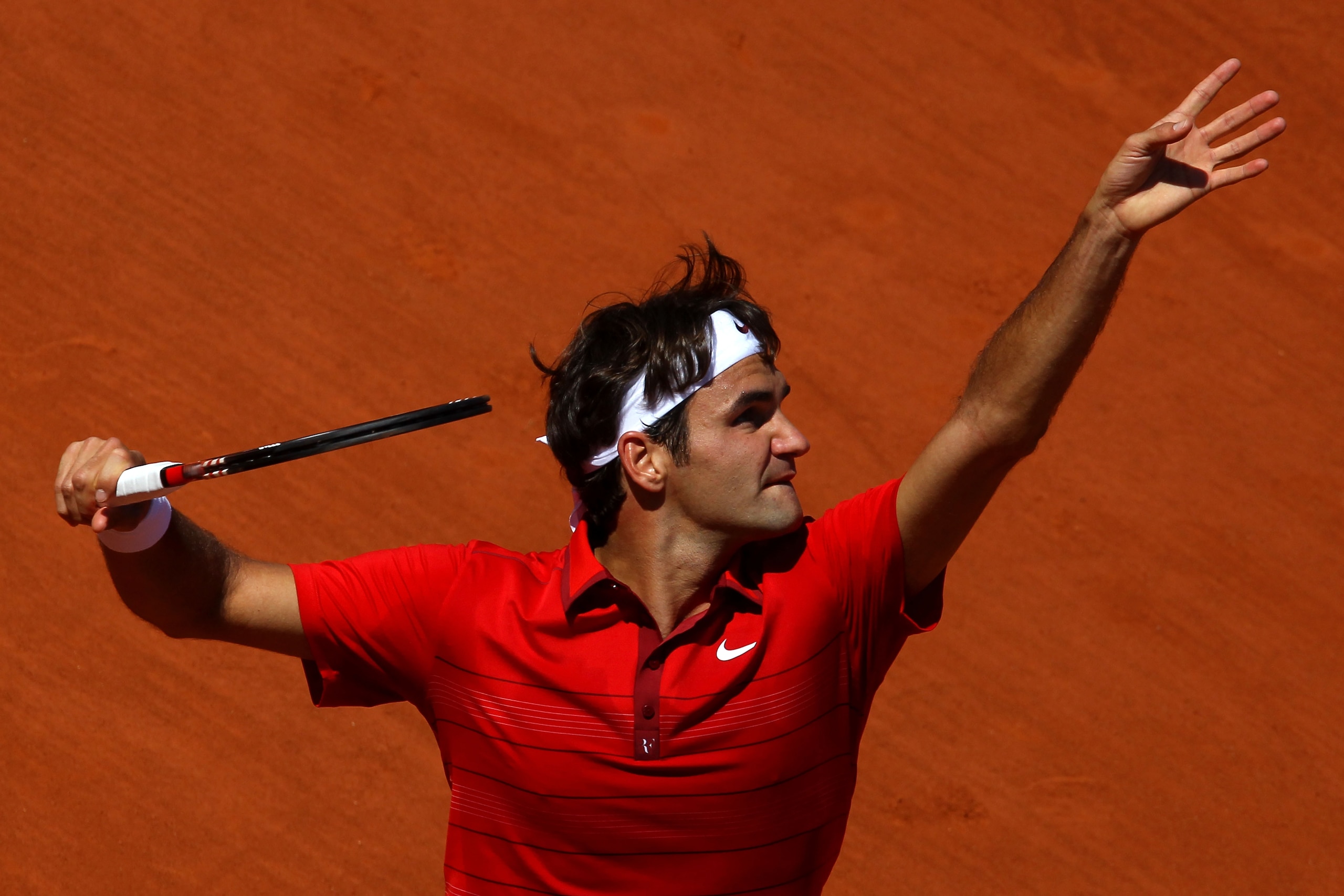PARIS, FRANCE - MAY 23:  Roger Federer of Switzerland serves during the men's singles first round match between Feliciano Lopez of Spain and Roger Federer of Switzerland on day two of the French Open at Roland Garros on May 23, 2011 in Paris, France.  (Ph