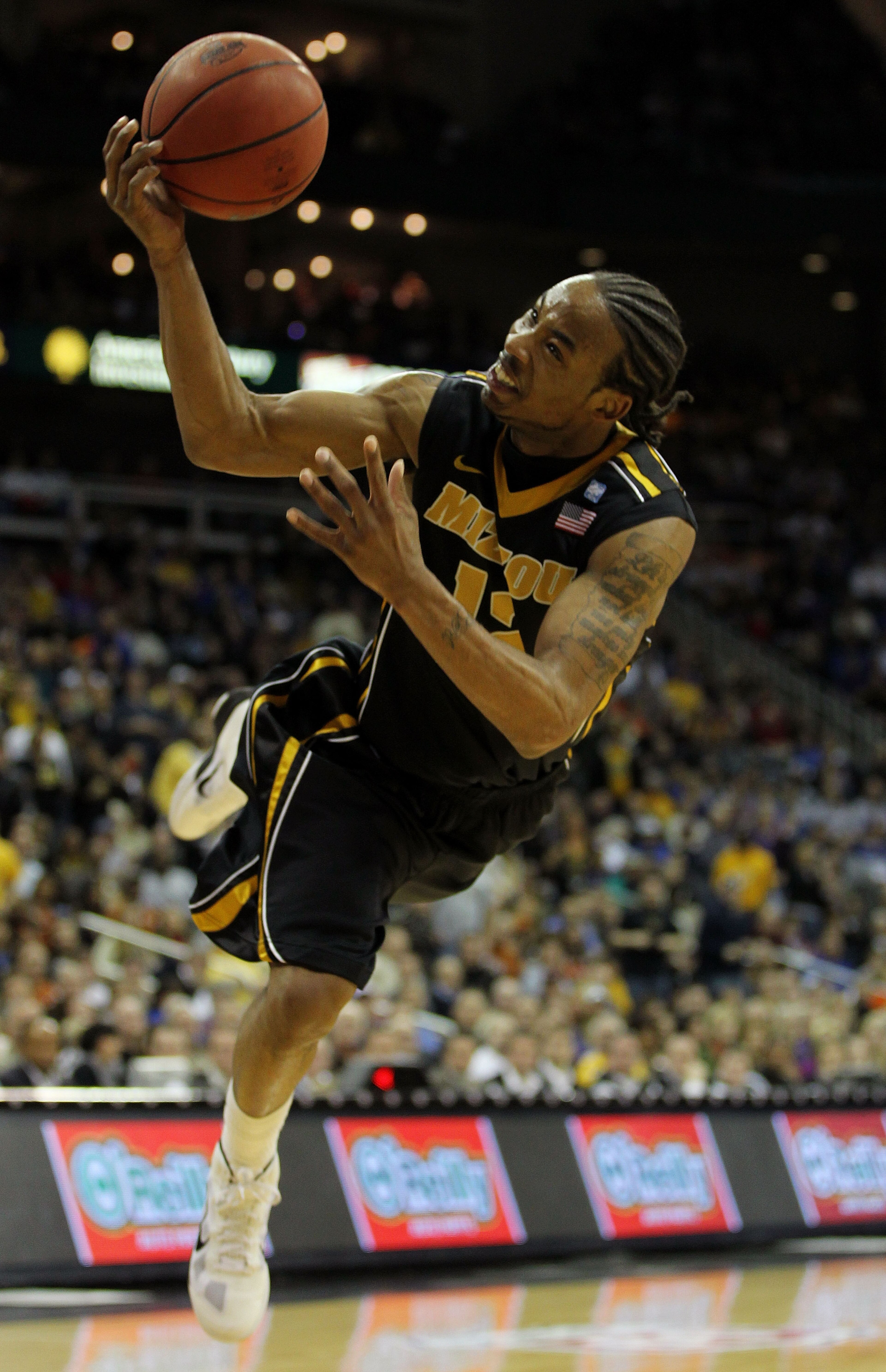 KANSAS CITY, MO - MARCH 10: Marcus Denmon #12 of the Missouri Tigers throws a shot up against the Texas A&M Aggies during their quarterfinal game in the 2011 Phillips 66 Big 12 Men's Basketball Tournament at Sprint Center on March 10, 2011 in Kansas City KANSAS CITY, MO - MARCH 10: Marcus Denmon #12 of the Missouri Tigers throws a shot up against the Texas A&M Aggies during their quarterfinal game in the 2011 Phillips 66 Big 12 Men's Basketball Tournament at Sprint Center on March 10, 2011 in Kansas City