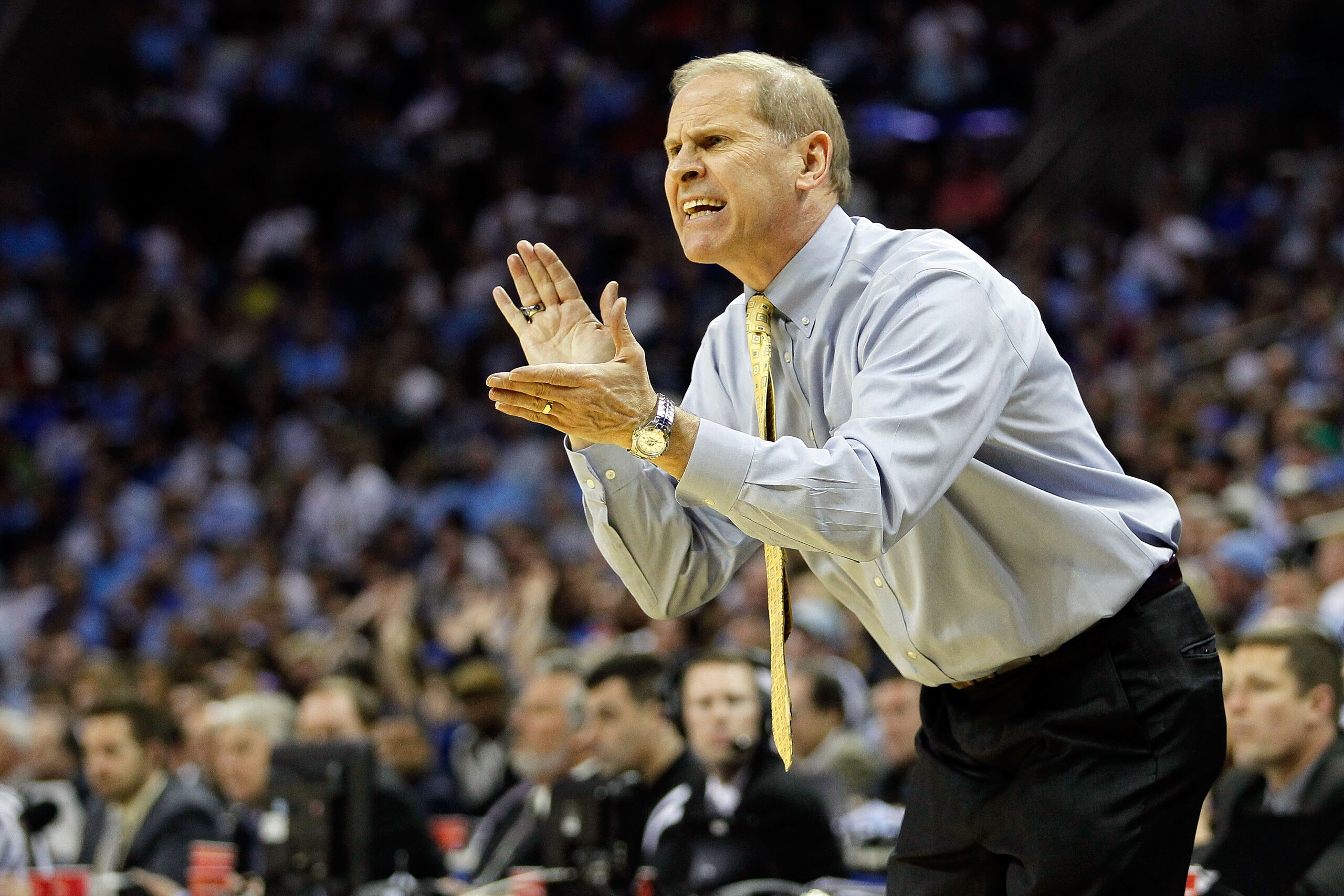 CHARLOTTE, NC - MARCH 20: Head coach John Beilein of the Michigan Wolverines reacts while taking on the Duke Blue Devils during the third round of the 2011 NCAA men's basketball tournament at Time Warner Cable Arena on March 20, 2011 in Charlotte, North CHARLOTTE, NC - MARCH 20: Head coach John Beilein of the Michigan Wolverines reacts while taking on the Duke Blue Devils during the third round of the 2011 NCAA men's basketball tournament at Time Warner Cable Arena on March 20, 2011 in Charlotte, North