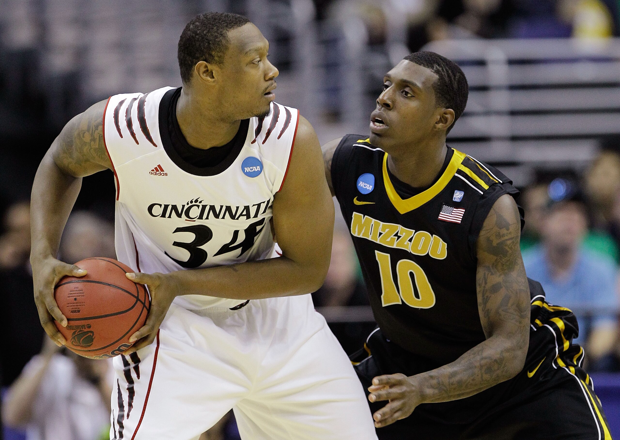 WASHINGTON - MARCH 17: Ricardo Ratliffe #10 of the Missouri Tigers defends Yancy Gates #34 of the Cincinnati Bearcats during the second round of the 2011 NCAA men's basketball tournament at the Verizon Center on March 17, 2011 in Washington, DC. (Photo WASHINGTON - MARCH 17: Ricardo Ratliffe #10 of the Missouri Tigers defends Yancy Gates #34 of the Cincinnati Bearcats during the second round of the 2011 NCAA men's basketball tournament at the Verizon Center on March 17, 2011 in Washington, DC. (Photo