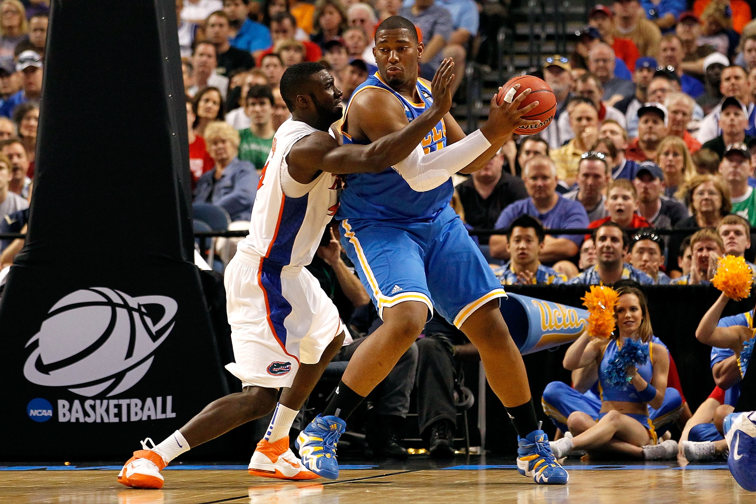 TAMPA, FL - MARCH 19: Joshua Smith #34 of the UCLA Bruins posts up against Patric Young #4 of the Florida Gators during the third round of the 2011 NCAA men's basketball tournament at St. Pete Times Forum on March 19, 2011 in Tampa, Florida. Florida won TAMPA, FL - MARCH 19: Joshua Smith #34 of the UCLA Bruins posts up against Patric Young #4 of the Florida Gators during the third round of the 2011 NCAA men's basketball tournament at St. Pete Times Forum on March 19, 2011 in Tampa, Florida. Florida won