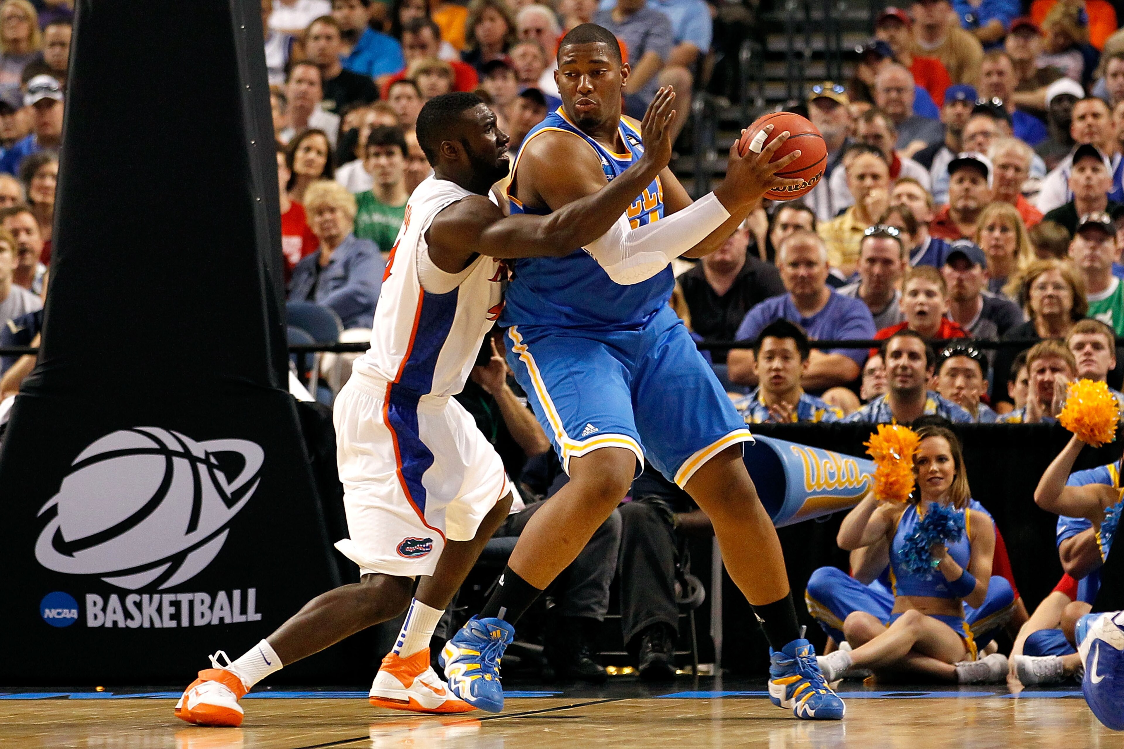 TAMPA, FL - MARCH 19: Joshua Smith #34 of the UCLA Bruins posts up against Patric Young #4 of the Florida Gators during the third round of the 2011 NCAA men's basketball tournament at St. Pete Times Forum on March 19, 2011 in Tampa, Florida. Florida won TAMPA, FL - MARCH 19: Joshua Smith #34 of the UCLA Bruins posts up against Patric Young #4 of the Florida Gators during the third round of the 2011 NCAA men's basketball tournament at St. Pete Times Forum on March 19, 2011 in Tampa, Florida. Florida won