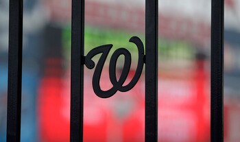 WASHINGTON, DC - MARCH 31:  The Washington Nationals logo is shown on the fence entering the park at Nationals Park before the start of the Atlanta Braves and Washington Nationals opening day game on March 31, 2011 in Washington, DC.  (Photo by Rob Carr/G