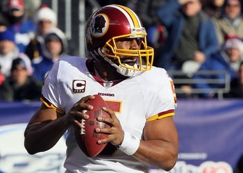 EAST RUTHERFORD, NJ - DECEMBER 05:  Donovan McNabb #5 of the Washington Redskins looks to throw a pass against the New York Giants on December 5, 2010 at the New Meadowlands Stadium in East Rutherford, New Jersey. The Giants defeated the Redskins 31-7.  (