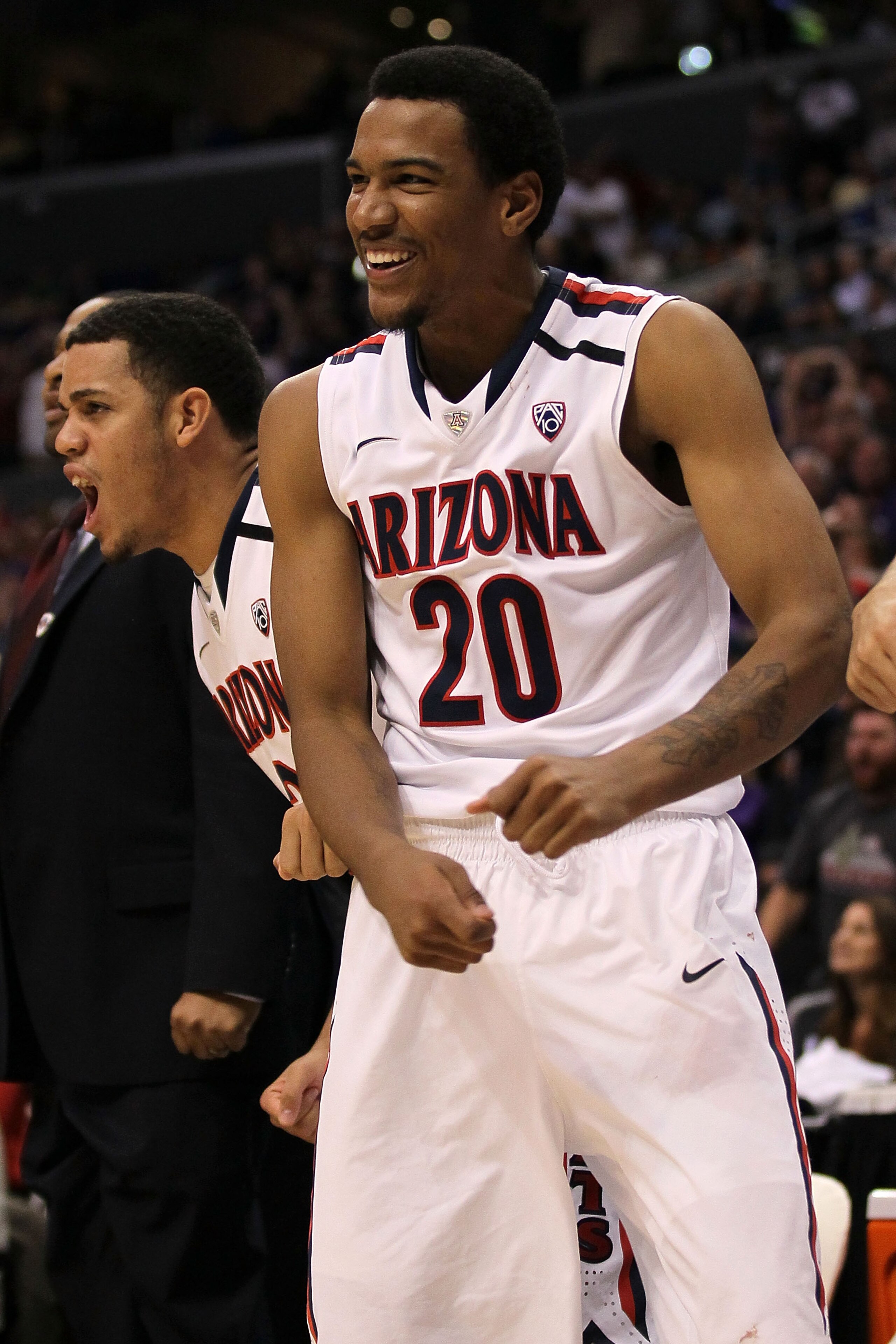 LOS ANGELES, CA - MARCH 12: Jordin Mayes #20 of the Arizona Wildcats reacts from the bench while taking on the Washington Huskies in the championship game of the 2011 Pacific Life Pac-10 Men's Basketball Tournament at Staples Center on March 12, 2011 in LOS ANGELES, CA - MARCH 12: Jordin Mayes #20 of the Arizona Wildcats reacts from the bench while taking on the Washington Huskies in the championship game of the 2011 Pacific Life Pac-10 Men's Basketball Tournament at Staples Center on March 12, 2011 in