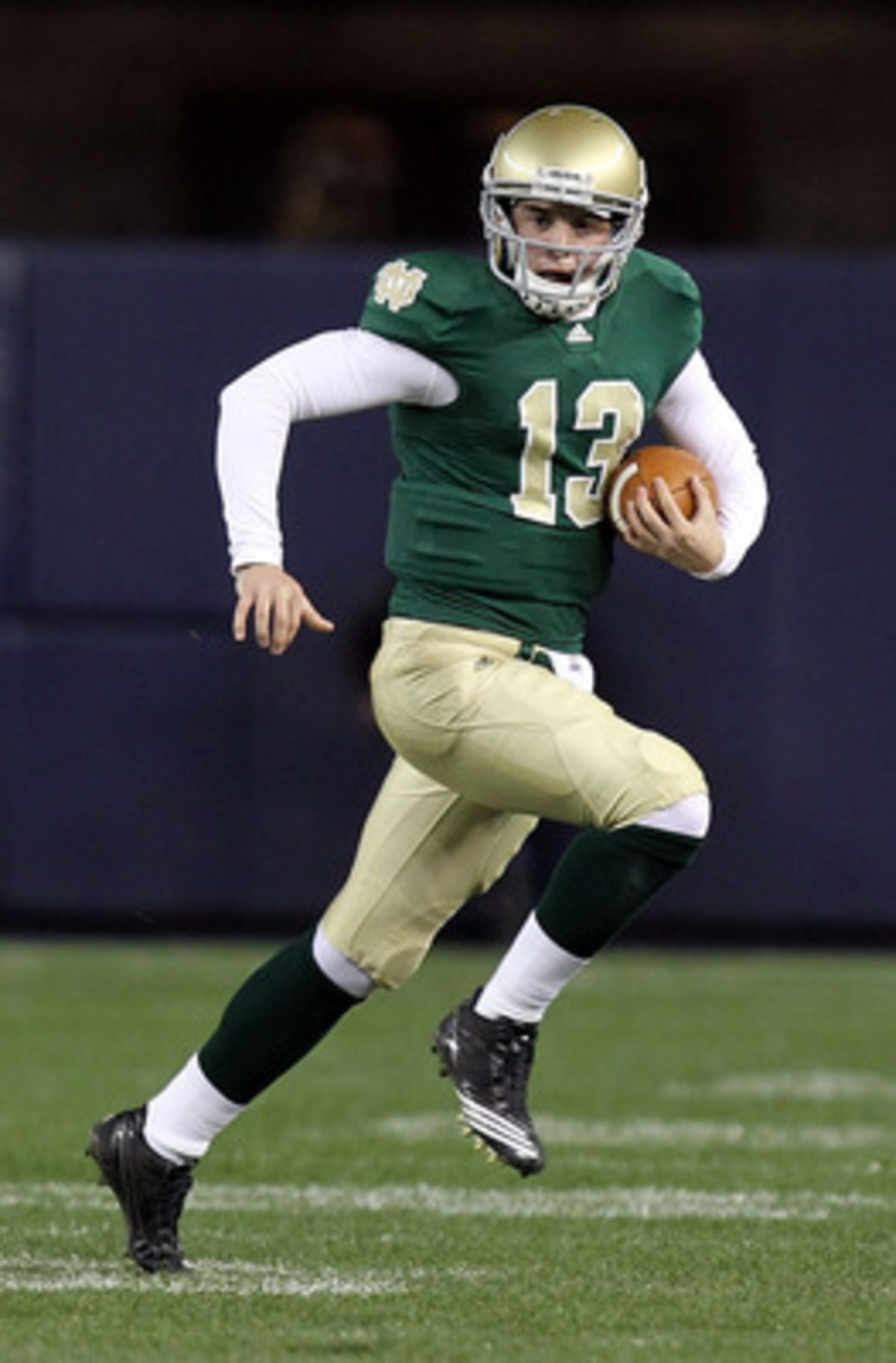 NEW YORK - NOVEMBER 20: Tommy Rees #13 of the Notre Dame Fighting Irish rushes agaisnt the Army Black Knights at Yankee Stadium on November 20, 2010 in the Bronx borough of New York City.  (Photo by Nick Laham/Getty Images)