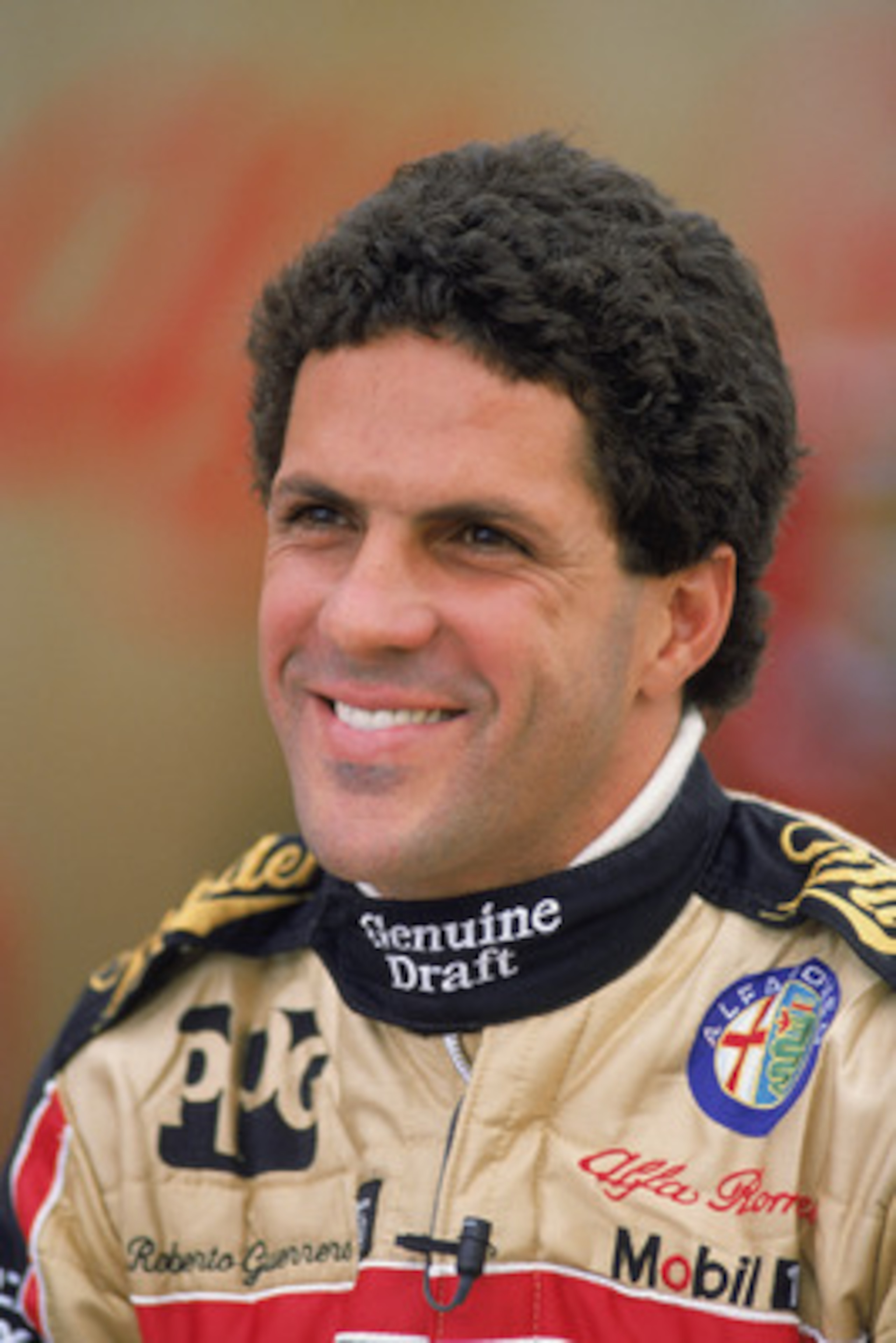 LONG BEACH, CA - APRIL 22:  Patrick driver Roberto Guerrero of Colombia smiles before the Toyota Grand Prix of Long Beach on the Long Beach Road Course in Long Beach, California on April 22, 1990.  (Photo by Ken Levine /Getty Images)
