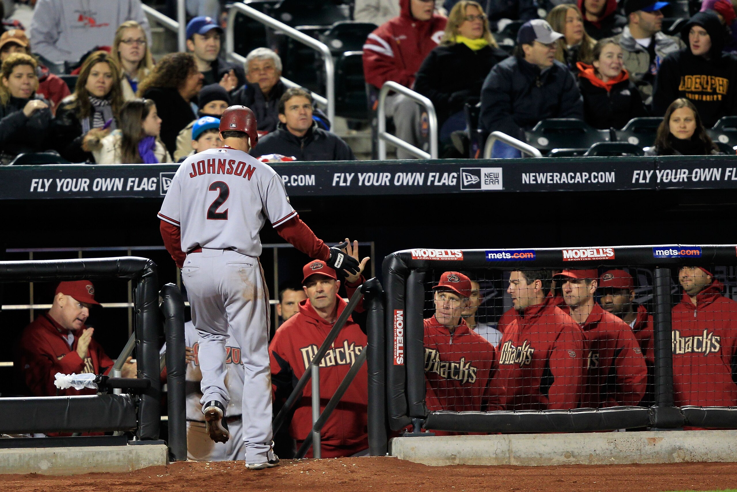 NEW YORK, NY - APRIL 22: Kelly Johnson #2 of the Arizona Diamondbacks makes his way back to the dugout after scoring in the third inning against the New York Mets at Citi Field on April 22, 2011 in the Flushing neighborhood of the Queens borough of New Yo