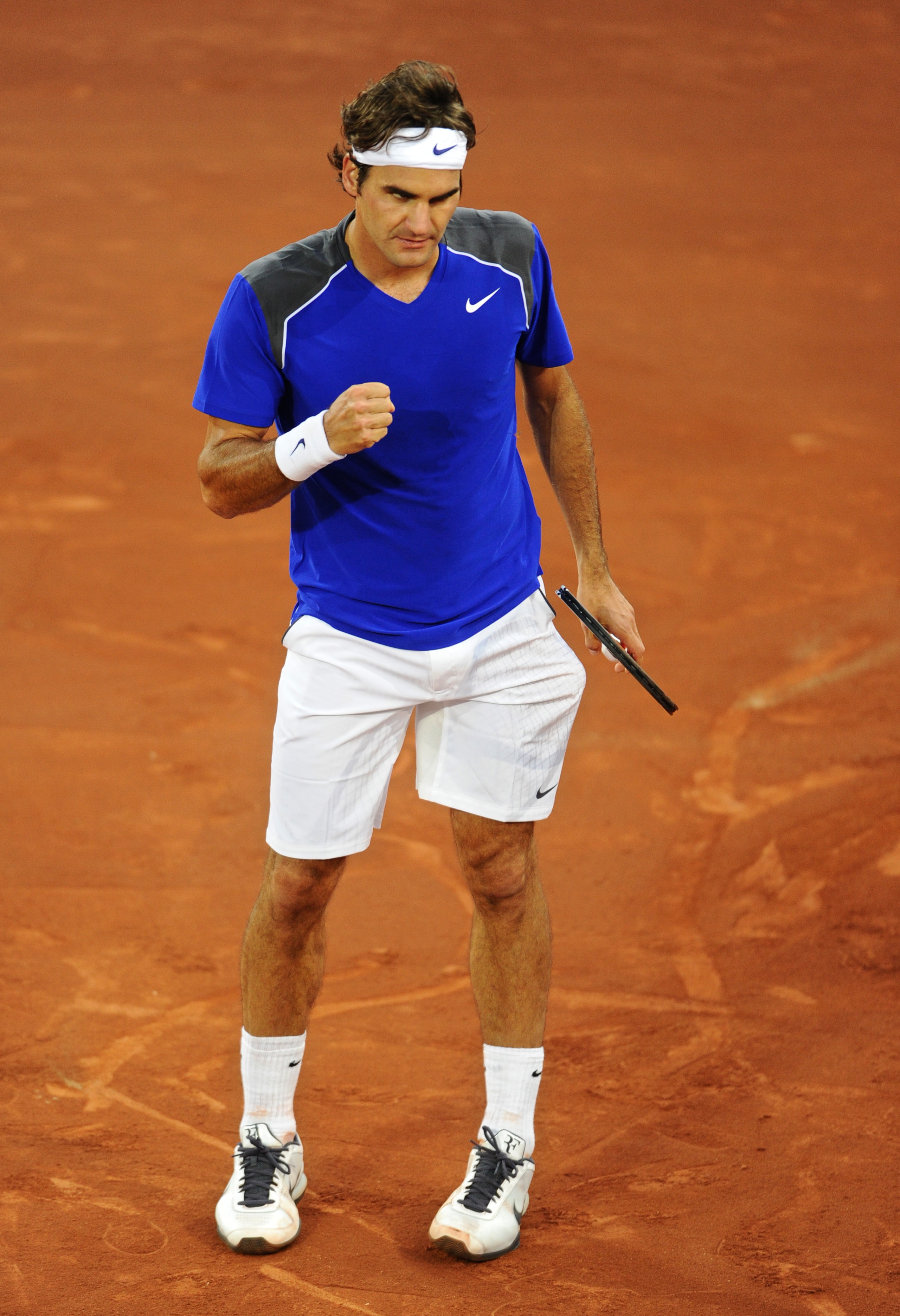 MADRID, SPAIN - MAY 06:  Roger Federer of Switzerland celebrates after winning match point against Robin Soderling of Sweden during day seven of the Mutua Madrilena Madrid Open Tennis on May 6, 2011 in Madrid, Spain. Federer won the match in straight sets