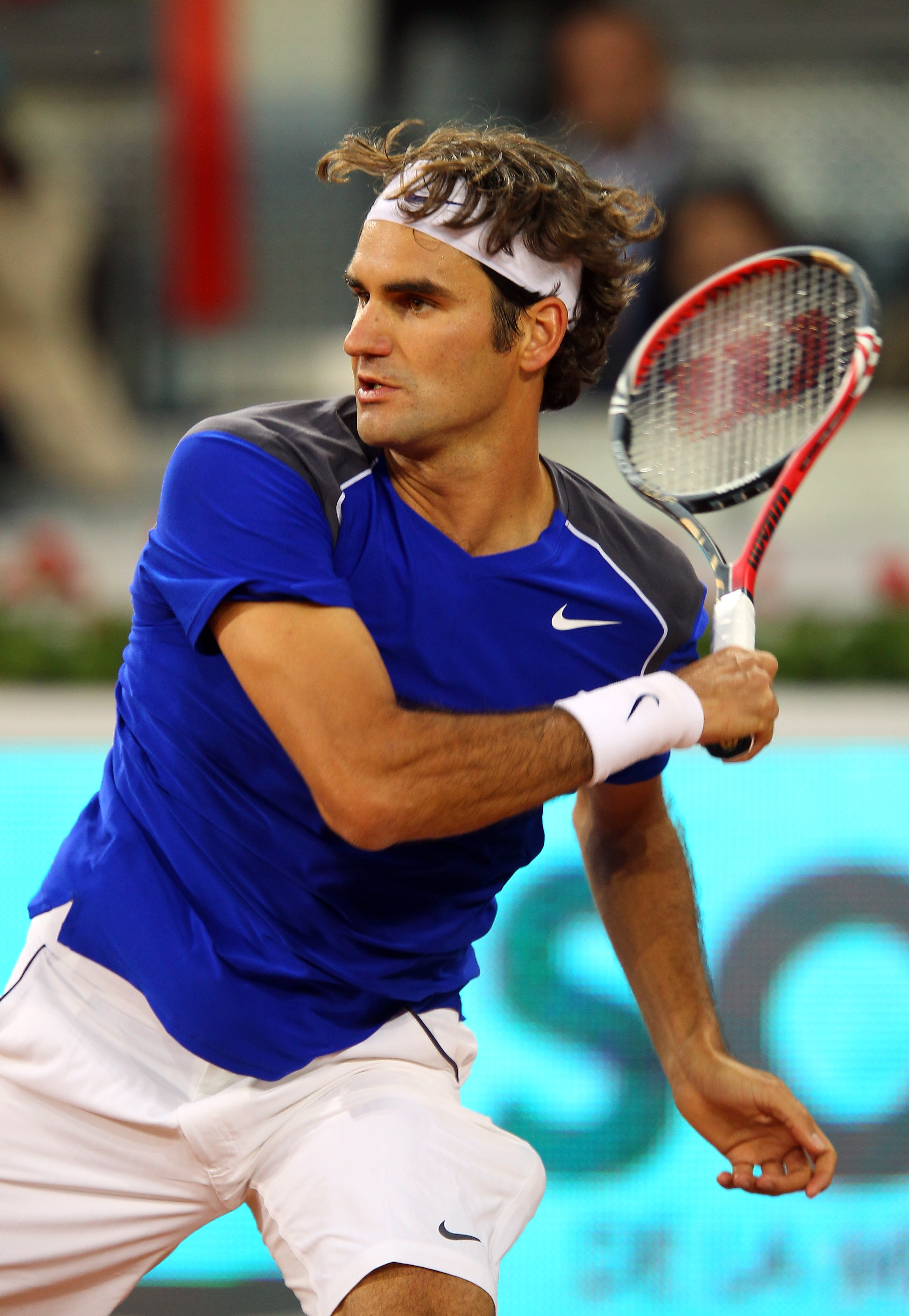 MADRID, SPAIN - MAY 04:  Roger Federer of Switzerland plays a forehand in his match against Feliciano Lopez of Spain during day five of the Mutua Madrilena Madrid Open Tennis on May 4, 2011 in Madrid, Spain.  (Photo by Julian Finney/Getty Images)