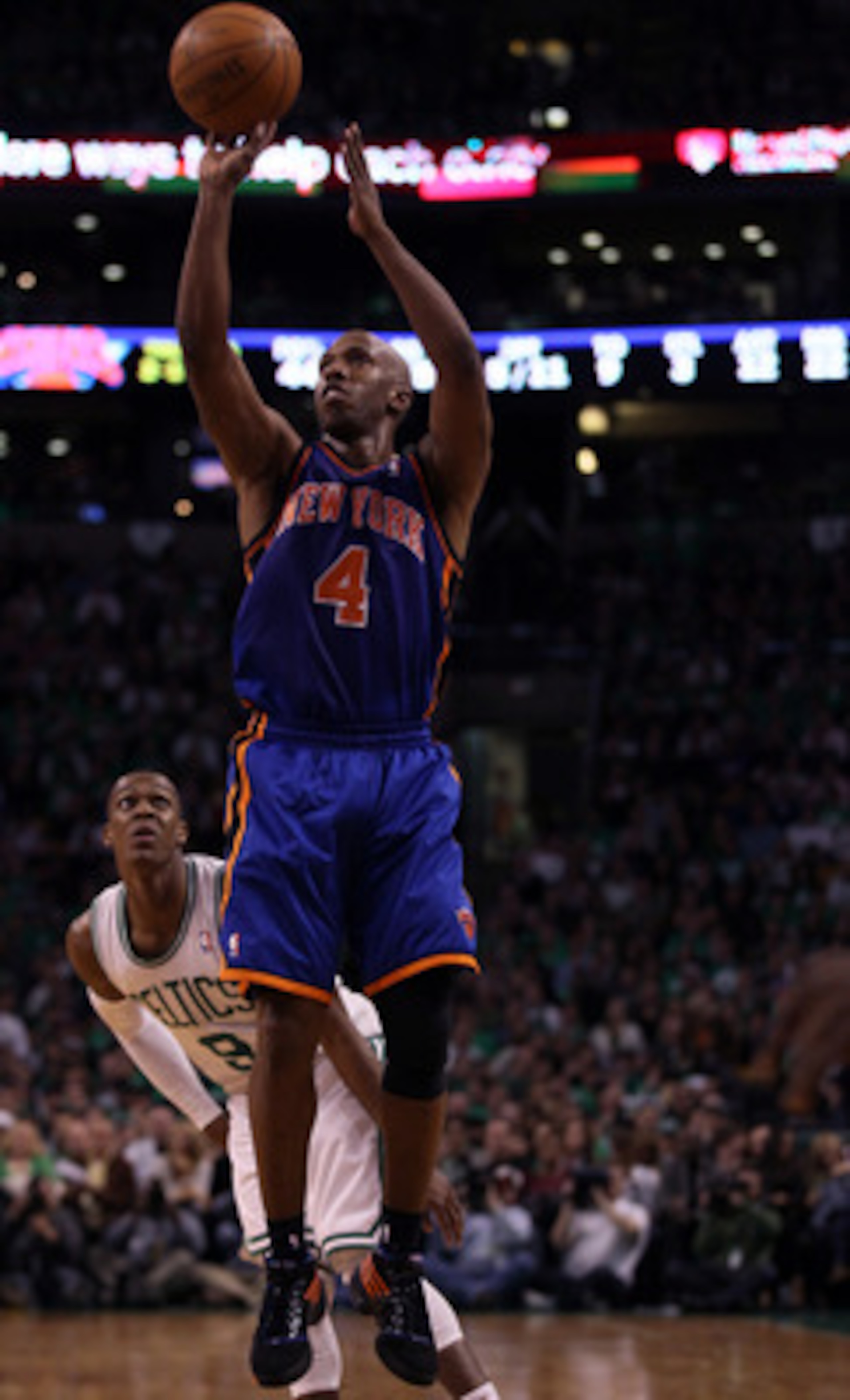 BOSTON, MA - APRIL 17:  Chauncey Billups #4 of the New York Knicks takes a shot as Rajon Rondo #9 of the Boston Celtics defends in Game One of the Eastern Conference Quarterfinals in the 2011 NBA Playoffs on April 17, 2011 at the TD Garden in Boston, Mass