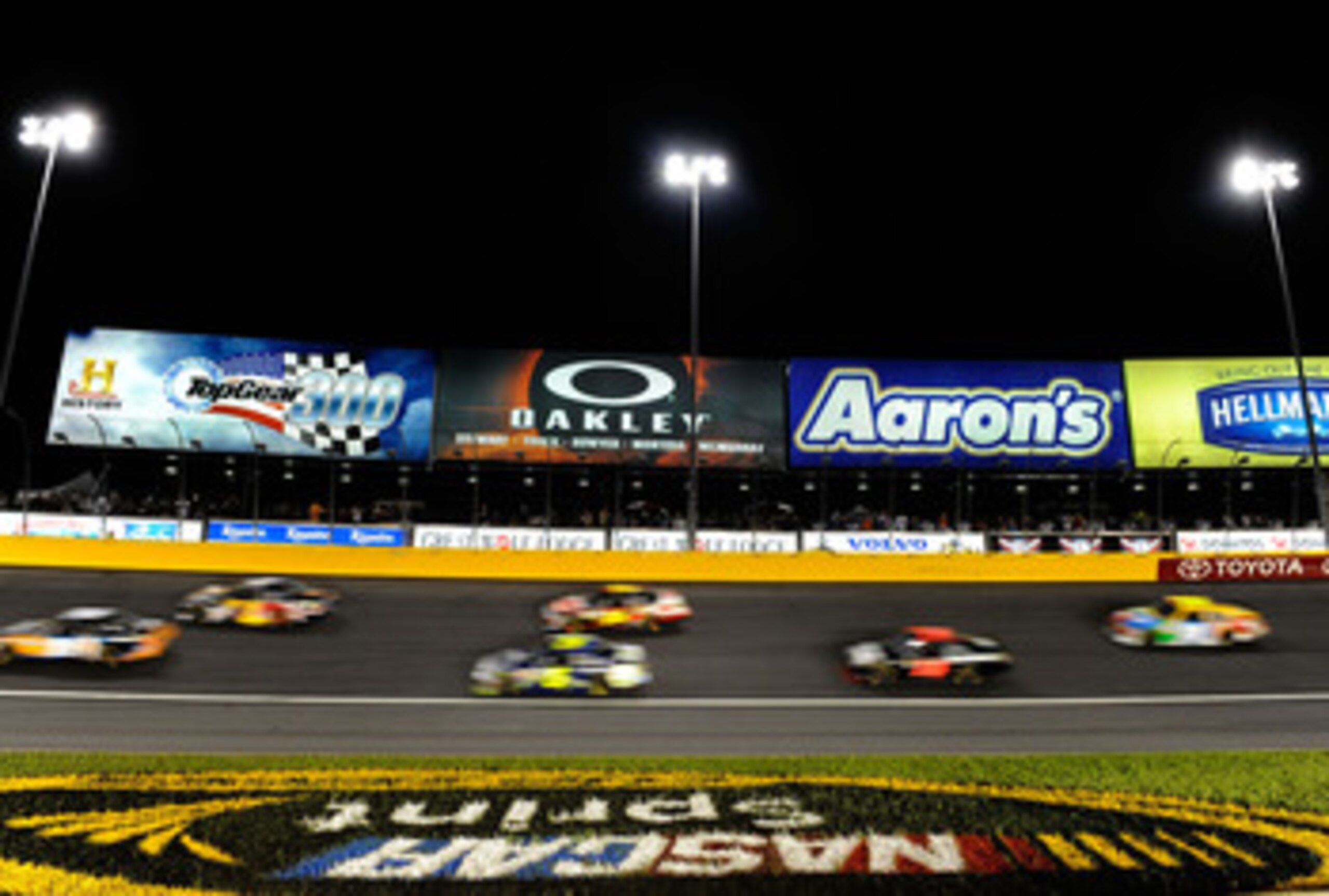 CHARLOTTE, NC - MAY 21:  A view of cars racing during the NASCAR Sprint All-Star Race at Charlotte Motor Speedway on May 21, 2011 in Charlotte, North Carolina.  (Photo by John Harrelson/Getty Images for NASCAR)