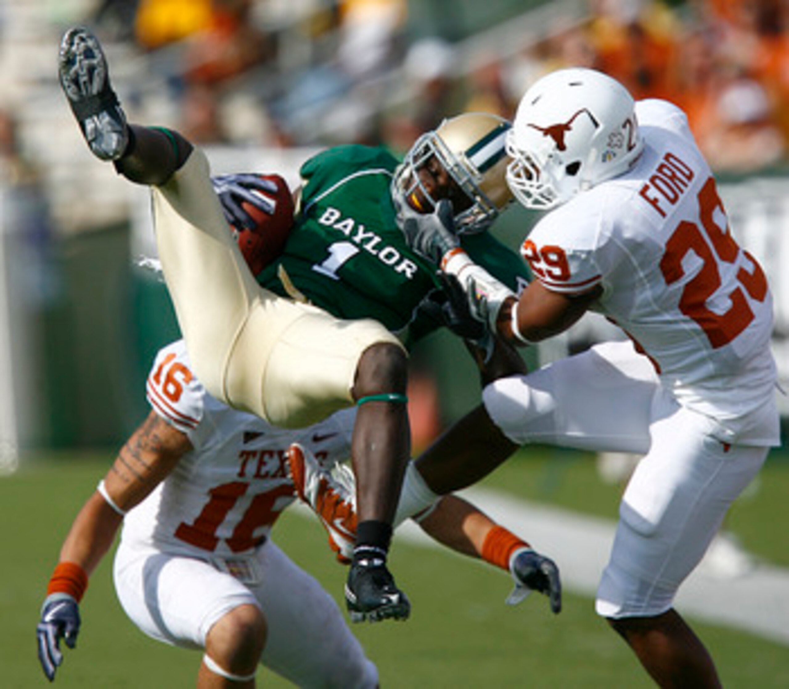 WACO, TX - NOVEMBER 14:  Inside receiver Kendall Wright #1 for the Baylor Bears pull in a pass against defensive back Clark Ford #29 for the Texas Longhorns in the second half on November 14, 2009 at Floyd Casey Stadium in Waco, Texas.  The Longhorns beat