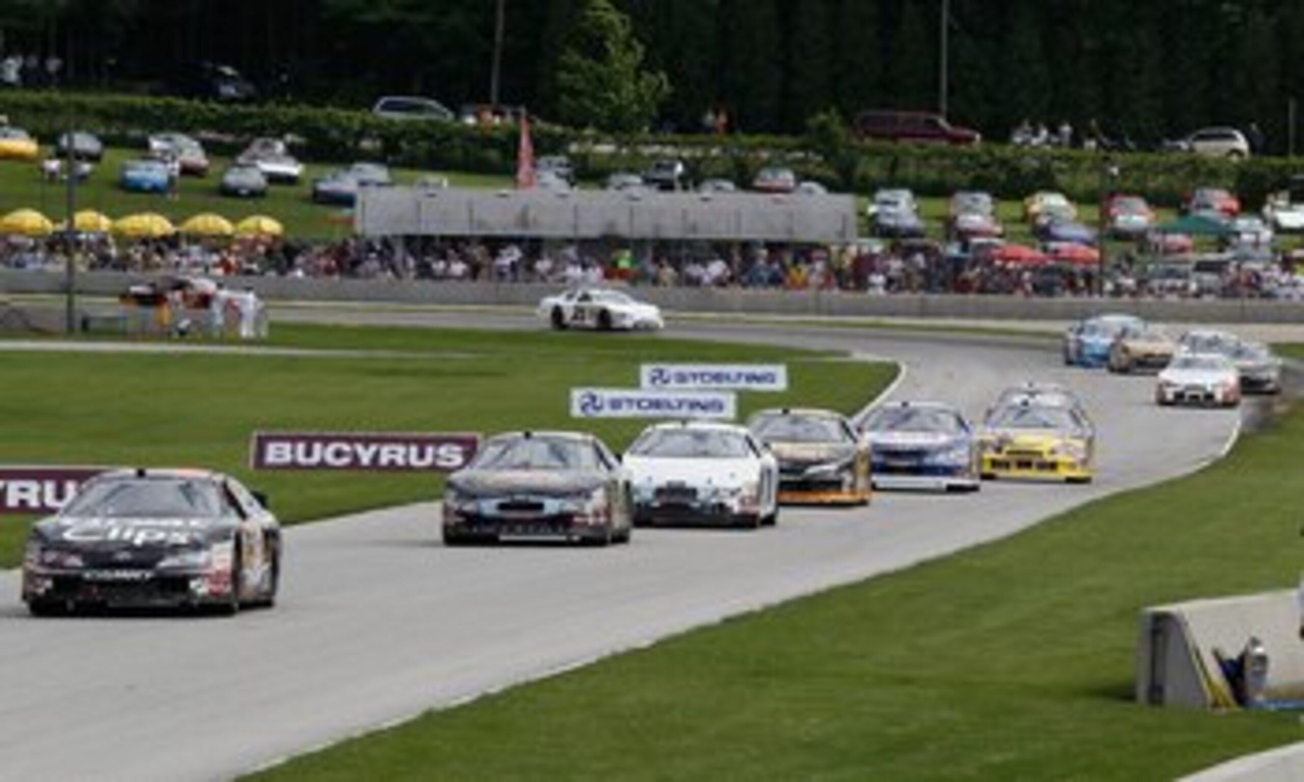 ELKHART LAKE, WI - JUNE 19: Cars lead by Jason Leffler, drining the #38 Great Clips Toyota, race during the NASCAR Nationwide Series Bucyrus 200 at Road America on June 19, 2010 in Elkhart Lake, Wisconsin. (Photo by Jonathan Daniel/Getty Images)