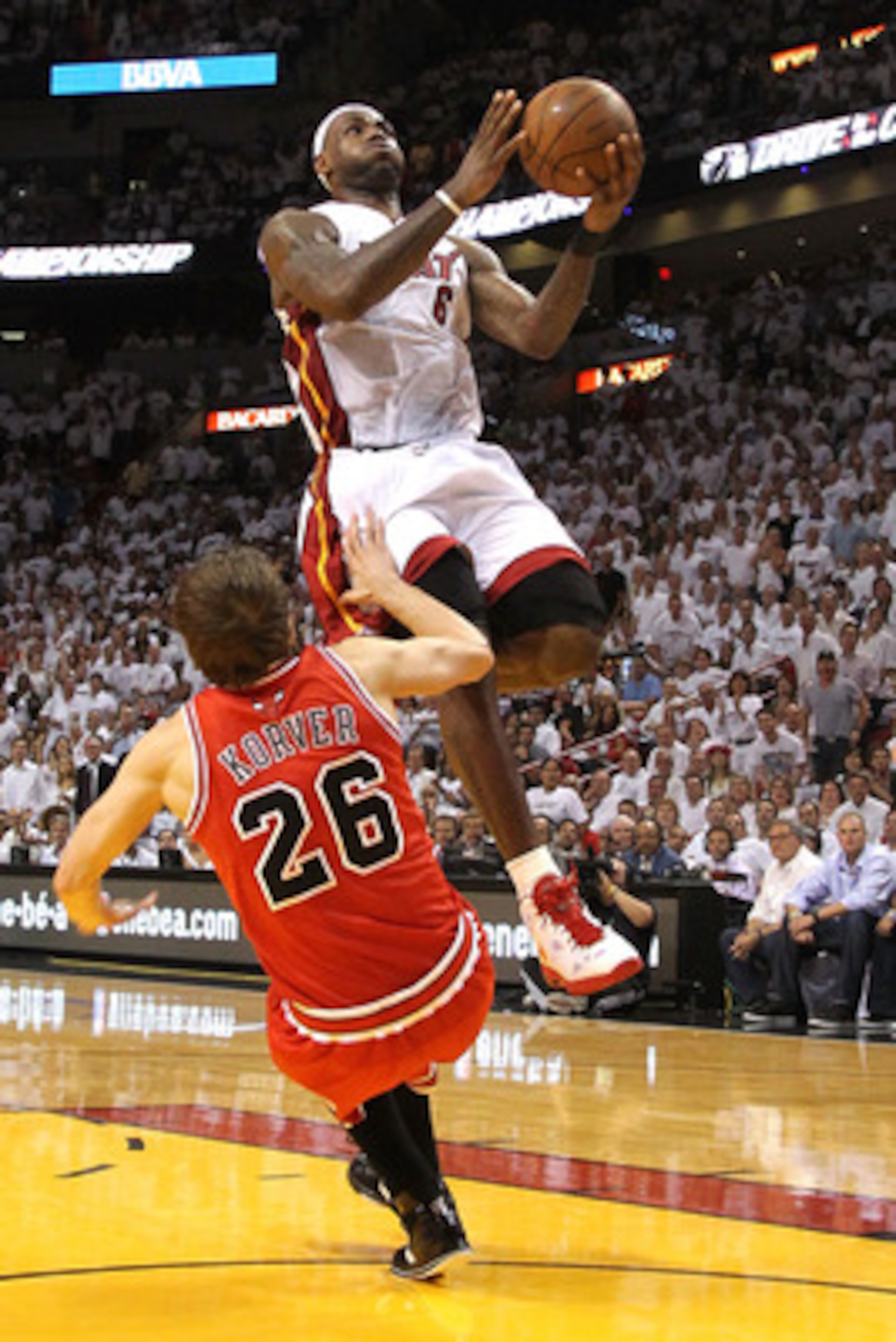 MIAMI, FL - MAY 22:  LeBron James #6 of the Miami Heat drives for a shot attempt against Kyle Korver #26 of the Chicago Bulls in Game Three of the Eastern Conference Finals during the 2011 NBA Playoffs on May 22, 2011 at American Airlines Arena in Miami, 