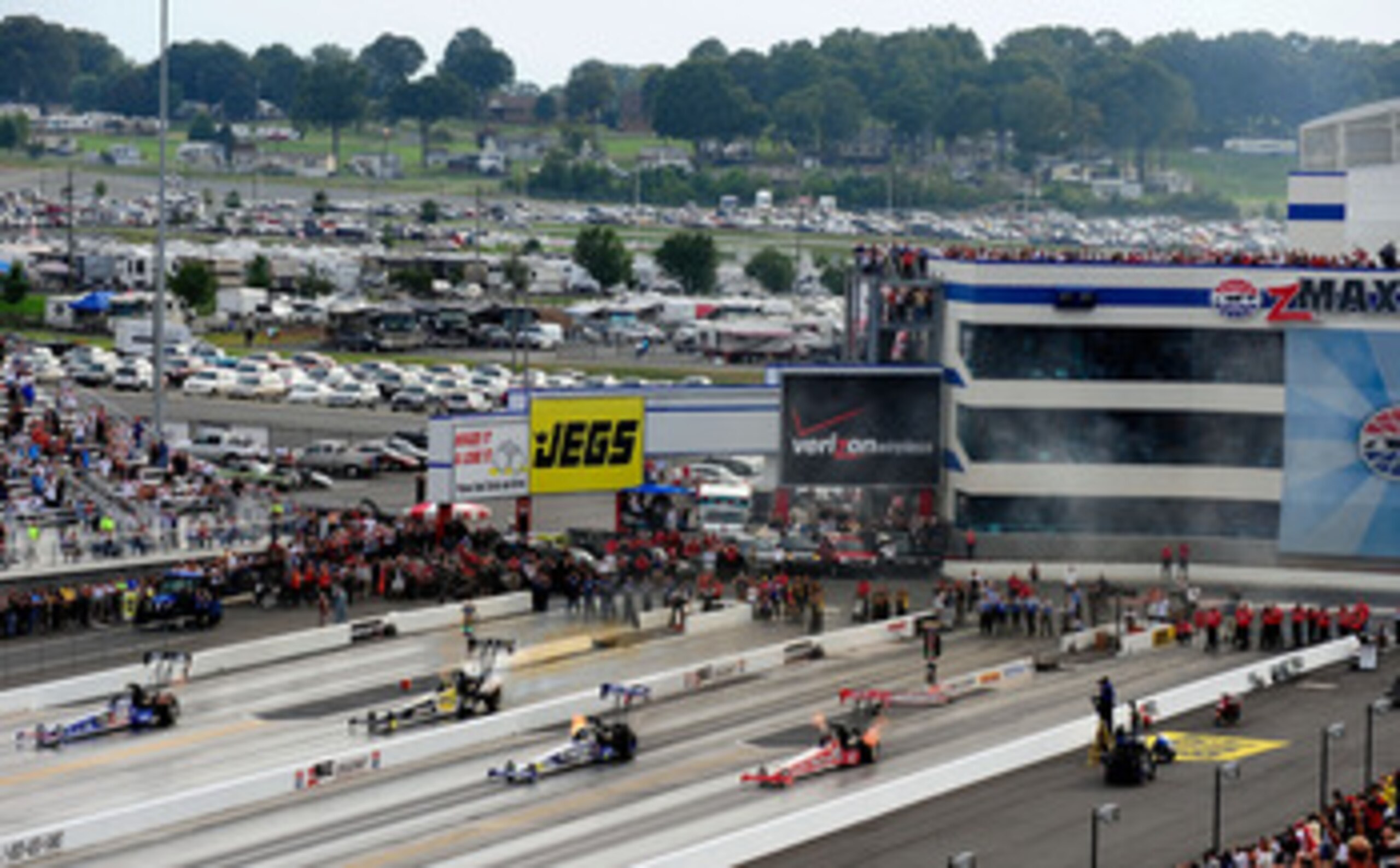CONCORD, NC - SEPTEMBER 20:  A general view of top fuel dragsters racing four wide as an exhibition during the NHRA Carolinas Nationals on September 20, 2009 at Zmax Dragway in Concord, North Carolina.  (Photo by Rusty Jarrett/Getty Images)