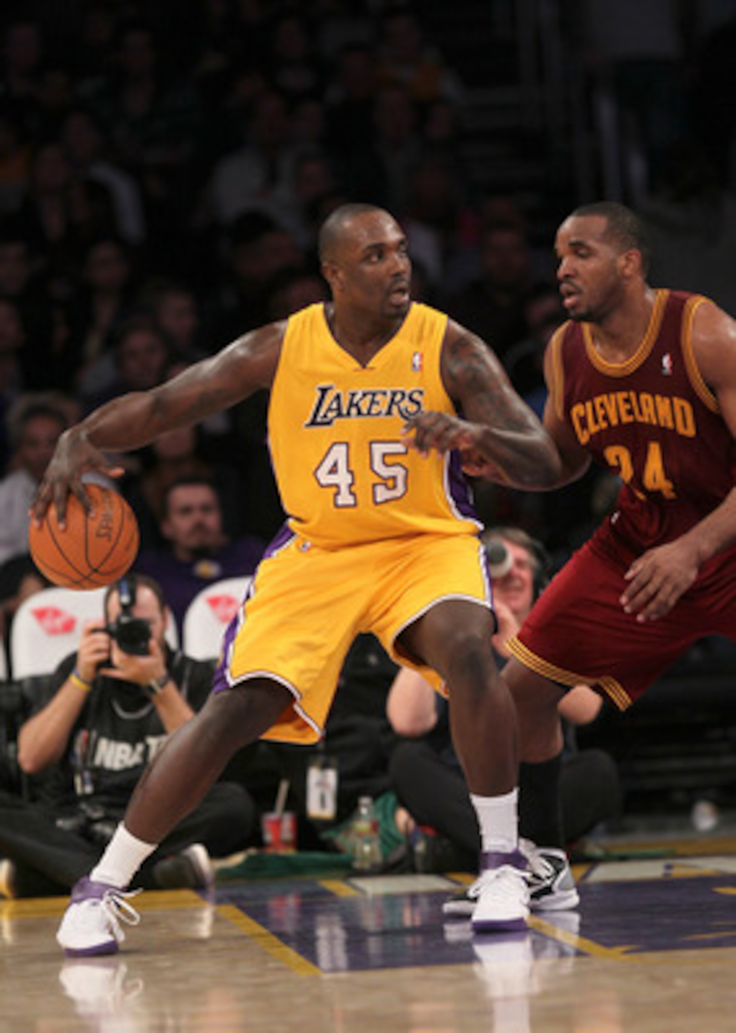 LOS ANGELES, CA - JANUARY 11:   Derrick Caracter #45 of the Los Angeles Lakers controls the ball against Samardo Samuels #24 of the Cleveland Cavaliers at Staples Center on January 11, 2011 in Los Angeles, California.  The Lakers won 112-57.  NOTE TO USER