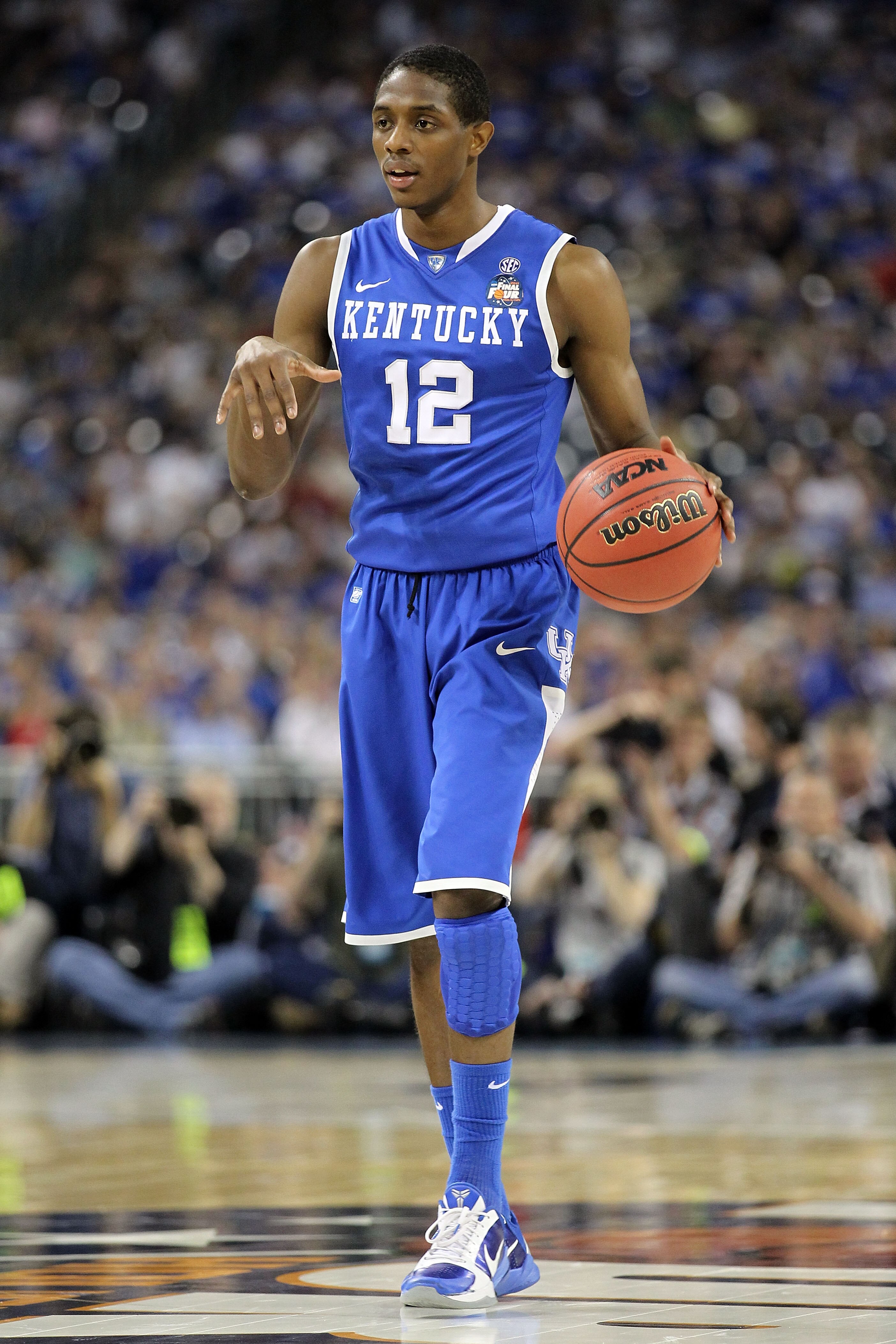 HOUSTON, TX - APRIL 02:  Brandon Knight #12 of the Kentucky Wildcats moves the ball while taking on the Connecticut Huskies during the National Semifinal game of the 2011 NCAA Division I Men's Basketball Championship at Reliant Stadium on April 2, 2011 in
