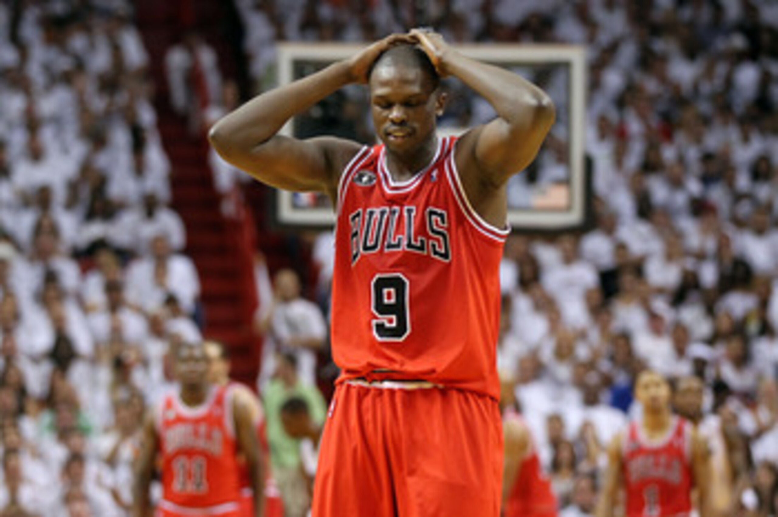 MIAMI, FL - MAY 22:  Luol Deng #9 of the Chicago Bulls walks up court with his head down against the Miami Heat in Game Three of the Eastern Conference Finals during the 2011 NBA Playoffs on May 22, 2011 at American Airlines Arena in Miami, Florida.  NOTE