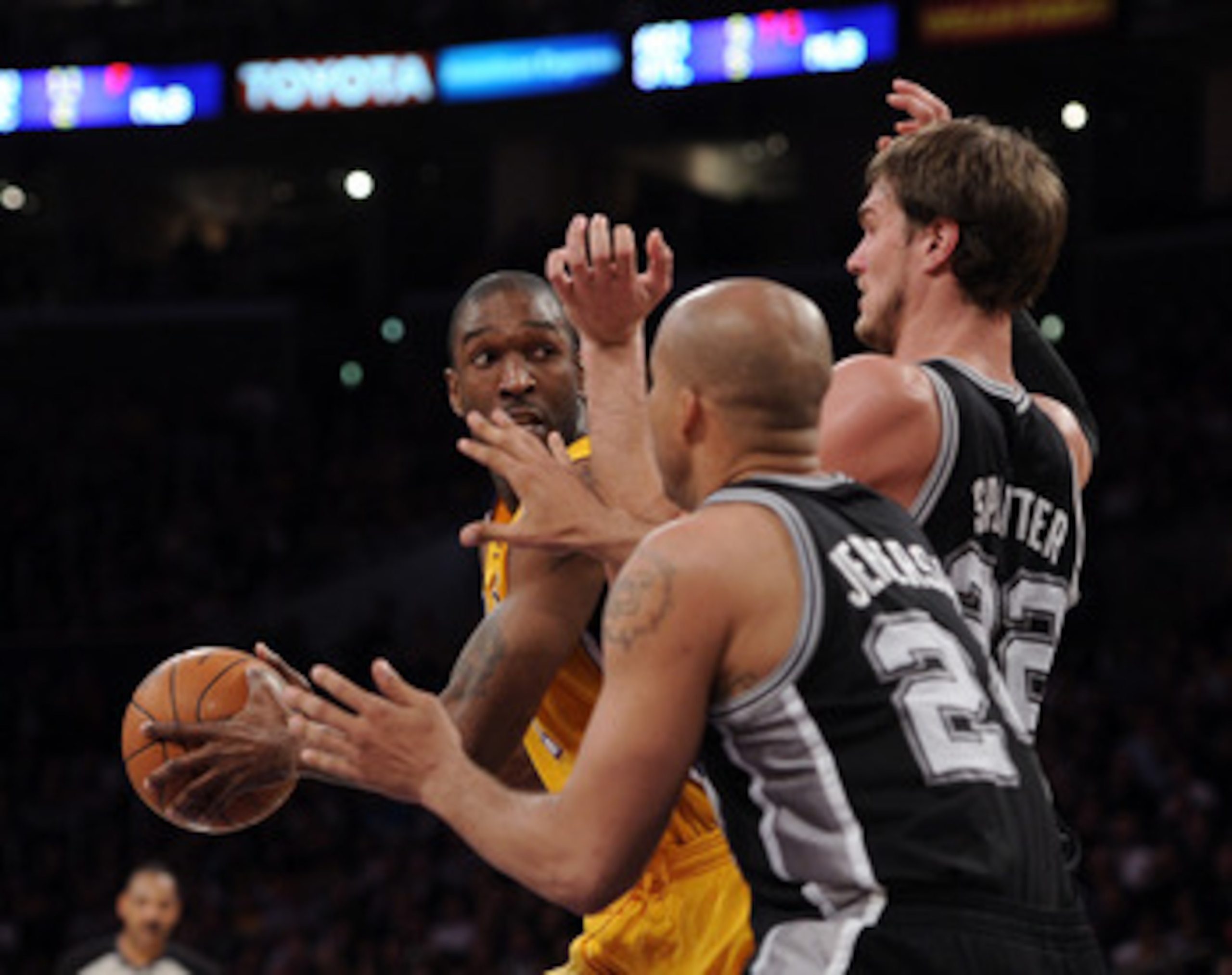 LOS ANGELES, CA - APRIL 12:  Joe Smith #1 of the Los Angeles Lakers grabs a rebound in front of Tiago Splitter #22 and Richard Jefferson #24 of the San Antonio Spurs at Staples Center on April 12, 2011 in Los Angeles, California.  NOTE TO USER: User expre