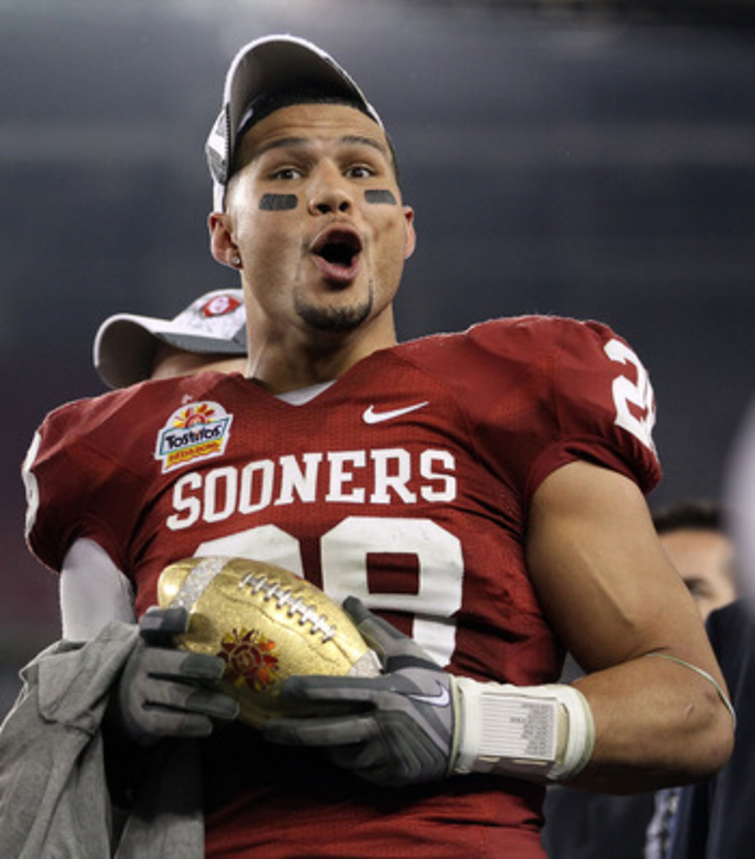 GLENDALE, AZ - JANUARY 01:  Travis Lewis #28 of the Oklahoma Sooners celebrates the Sooners 48-20 victory against the Connecticut Huskies during the Tostitos Fiesta Bowl at the Universtity of Phoenix Stadium on January 1, 2011 in Glendale, Arizona.  (Phot