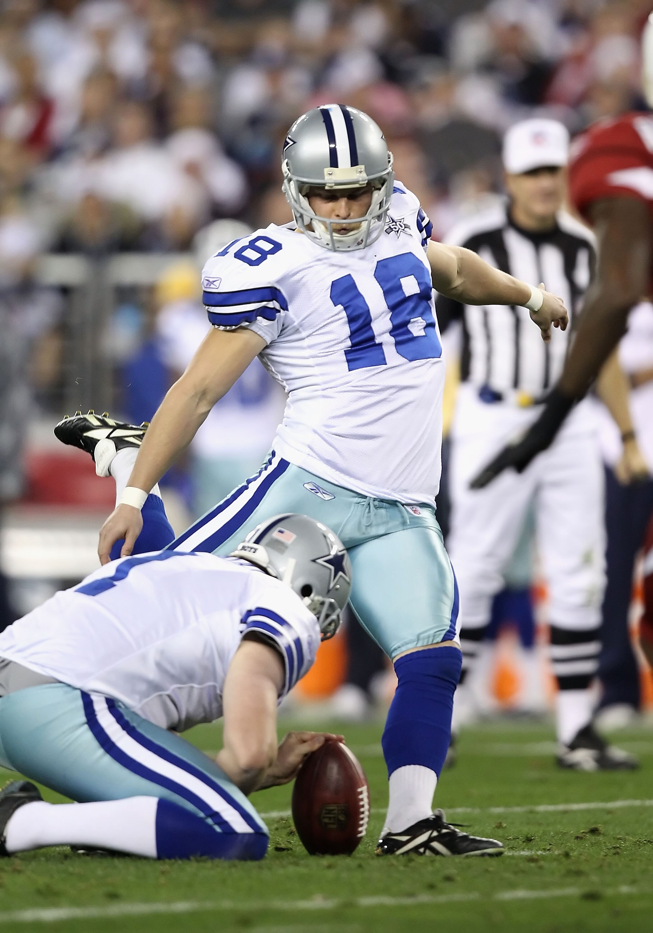 GLENDALE, AZ - DECEMBER 25:  Kicker David Buehler #18 of the Dallas Cowboys kicks a field goal during the NFL game against the Arizona Cardinals at the University of Phoenix Stadium on December 25, 2010 in Glendale, Arizona.  The Cardinals defeated the Co