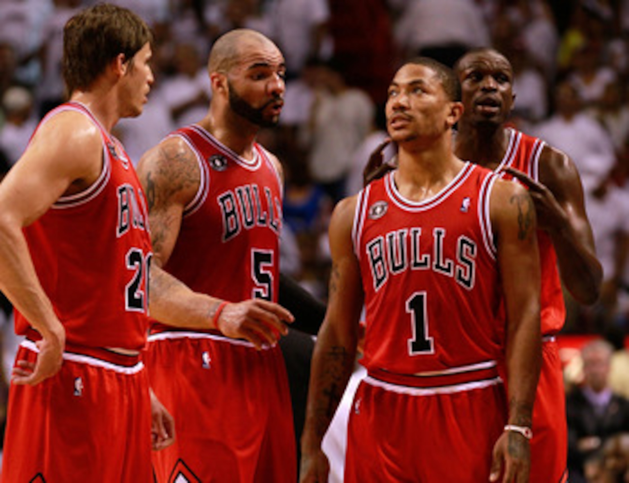MIAMI, FL - MAY 24: (L-R) Kyle Korver #26, Carlos Boozer #5, Derrick Rose #1 and Luol Deng #9 of the Chicago Bulls look on against the Miami Heat in Game Four of the Eastern Conference Finals during the 2011 NBA Playoffs on May 24, 2011 at American Airlin