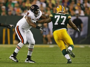 GREEN BAY, WI - SEPTEMBER 13: Orlando Pace #76 of the Chicago Bears tries to block Cullen Jenkins #77 of the Green Bay Packers on September 13, 2009 at Lambeau Field in Green Bay, Wisconsin. The Packers defeated the Bears 21-15. (Photo by Jonathan Daniel/
